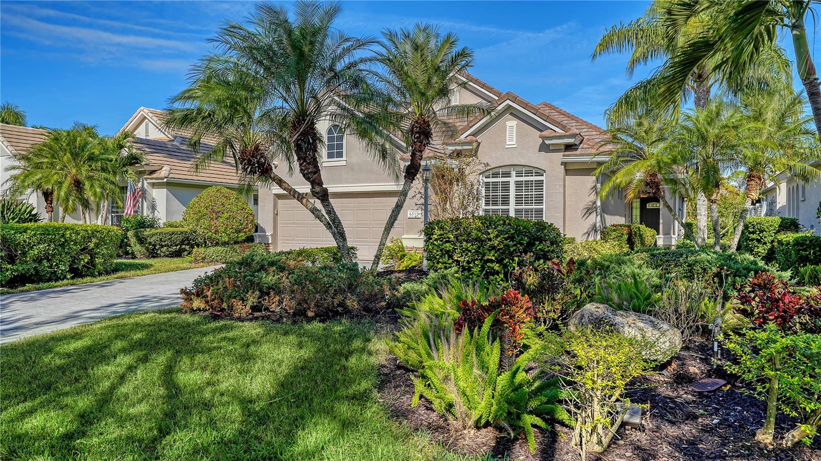 Virtually Staged. ***NEWLY PAINTED INTERIOR - NEWLY LOWERED PRICE***Enjoy the Florida lifestyle with effortless, 2 bedroom/2 bathroom + Den maintenance-free living in the desirable Muirfield neighborhood of Lakewood Ranch Country Club. This beautifully maintained home features a NEW ROOF and a tranquil preserve view with the golf course visible in the distance. The private, extended brick-paver lanai offers a versatile heated spa-pool, perfect for a refreshing dip or relaxing hydrotherapy, creating an ideal outdoor entertaining area.

The spacious owner’s suite includes a tiled sitting area with direct access to the spa-pool, along with a well-appointed en suite featuring dual vanities, a soaking tub, a separate frameless glass shower, and a walk-in closet with custom shelving and luggage storage.

Soaring twelve-foot ceilings, architectural niches, transom windows and built-ins enhance the light-filled great room and formal dining area, adding refined designer touches throughout. The kitchen is accented by granite countertops, an island, and eat in dining area, while privacy pocket doors open to a den that can be used for extra living space or a home office.

Additional outdoor living space includes a second screened patio, ideal for grilling or relaxing, accessible from the dining room through French doors or via a slider from the dinette. The intimate enclave of just 64 homes also offers a community pool, gathering area, and low HOA fees, completing this exceptional lifestyle opportunity.