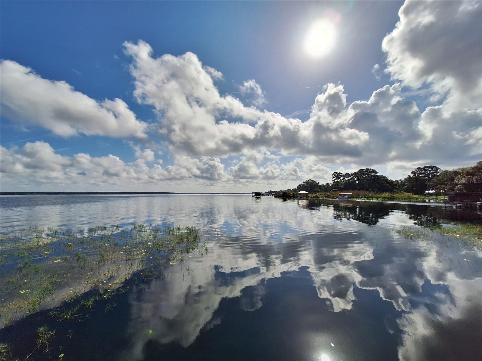 Includes access to Lake Kerr. 4 adjoining lots for a total of .87 acre. Zoned R4 for a house or mobile home. Lot 1 (85'x110') is a corner lot which fronts on NE 213th Ave & NE 135th ST. Lot 2 (85'x110'), lot 3 (85'x110') & lot 4 (90'x110') front on NE 135th ST. Community dock on Lake Kerr is only 200 yards walking distance from this property. (to find the water access from my yard sign drive north on 213th Ave, stay to the left on 213th Ave till you run in to the waters edge at the dock.) There is a public boat ramp/park with bathrooms called Moorehead Park just 2 miles or 5 min drive from this property to launch your boat for the weekend and its free.(The address of the park is 20740 NE 140th ST, Fort MC Coy, you check it out while you are here). The body of water on Lake Kerr consist of approx 9 square miles. Crystal clear water for swimming, boating & jet ski's. It is also well known for its Large mouth bass & Speck fishing. If your into the outdoors and nature this neighborhood adjoins the Ocala National Forest on 3 sides (only a 200ft walk away) giving you access to thousands of public land acres for trail riding, hiking, fishing and hunting, rarely ever having to touch a paved road. The Ocala National Forest also offers outdoor recreational activities such as Juniper, Alexander & Salt Springs for swimming, picnics, boating, campsites and the Florida Trail. Canoe rides on Juniper & Alexander runs. Buyer to pay doc stamps and title