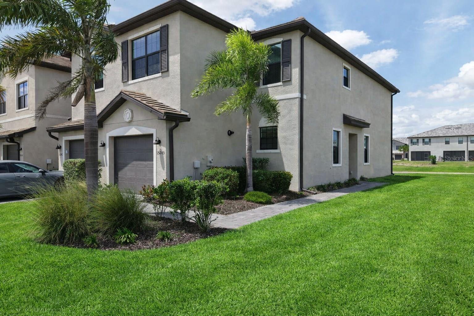 One or more photo(s) has been virtually staged. Experience the ultimate Lakewood Ranch lifestyle in this stunning three-bedroom, two and a half bathroom townhome nestled within the highly sought-after community of Lorraine Lakes. As you step inside, you are greeted by an inviting open floor plan accented with fresh, neutral paint throughout that creates a bright and airy atmosphere perfect for both relaxing and entertaining. The thoughtful layout places all the bedrooms upstairs for maximum privacy while the main living area flows seamlessly to your private outdoor patio. Imagine starting your mornings or winding down your evenings with a peaceful water view, as your patio overlooks a serene community pond.

The magic of living here extends far beyond your front door. Lorraine Lakes is renowned for its resort-style atmosphere where a full-time lifestyle director curates a vibrant calendar of events and activities for residents. You can spend your weekends lounging by the sparkling pool, grabbing a drink at the poolside bar, or perfecting your game on the putting green. For those who love to stay active, the options are endless with tennis, pickleball, and beach volleyball courts, plus a state-of-the-art fitness center that even includes an indoor basketball court. Families will appreciate the dedicated playground and diverse recreational facilities designed to keep everyone engaged.

Living in Lorraine Lakes means true convenience, as the HOA fees generously cover your internet and cable, professional lawn maintenance, and full access to all the incredible amenities. This is a rare opportunity to enjoy maintenance-free living in one of the premier master-planned communities in the country. Schedule your showing today and discover why this townhome is the perfect place to call home in the heart of Lakewood Ranch!