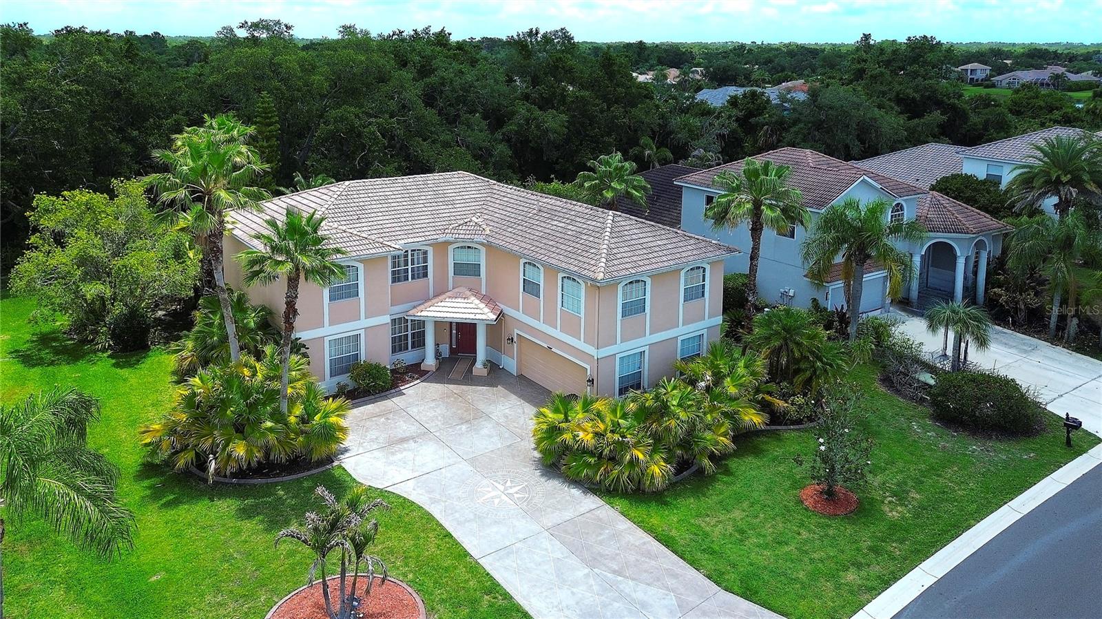FABULOUS OPPORTUNITY to own your own beautiful home in the very desirable and idyllic GATED community of GREYHAWK LANDING. This TWO STORY home has almost 3900 SqFt of LIVING SPACE, along with a side-entry DOUBLE GARAGE, and a SOLAR HEATED POOL, all on a coveted peaceful PRESERVE LOT with a backyard view of SERENE WOODS. This home's floorplan gives you options to fit your lifestyle with its 5-6 bedrooms, 3 full bathrooms, and "bonus" rooms. The first floor has one bedroom & bath, an amazing kitchen which flows into the living room, a separate dining room, an inside laundry room, and a bonus room that could be an office, family room, den, or whatever you decide. The living room and kitchen are filled with an abundance of natural light with sliders that open directly onto the caged pool area. The lush thick woods provide a beautifully private & peaceful backdrop to the pool. You will love the gorgeous REAL HARWOOD FLOORS in some of the downstairs rooms. Going up the stairs to the 2nd floor, you will find the PRIMARY BEDROOM with its en suite bathroom, along with 3 more bedrooms, another bathroom, and a very large "bonus" room which could be a 6th bedroom or a play room, school room, game room, fitness room, or whatever suits your fancy. The very large PRIMARY SUITE has a bonus comfy cozy sitting area as well as a large bathroom with dual vanities, a separate walk-in shower, and garden tub. Some of the extra features this home affords are dual AC systems, natural gas for the kitchen and water heater, a Rainbird sprinkler system, solar heated pool, hurricane shutters, mature landscaping and so much more. As soon as you enter GreyHawk Landing and drive down the main blvd with its lush canopy of trees and see the various ponds and fountains along the way, you realize you're in a very special neighborhood. There are actually 2 resort-style pools and clubhouses along with a fitness room, tennis, pickleball, & baskeball courts, baseball & soccer fields, and scenic walking trails. And the HOA is only $75/year! The CDD fee is included with your annual Property Taxes. GreyHawk Landing is conveniently located off SR 64, just east of I-75, just minutes to a variety of shopping & eating establishments, medical facilities, and a host of other amenities including our beautiful Gulf beaches. This is your opportunity to live the Florida lifestyle in style.
