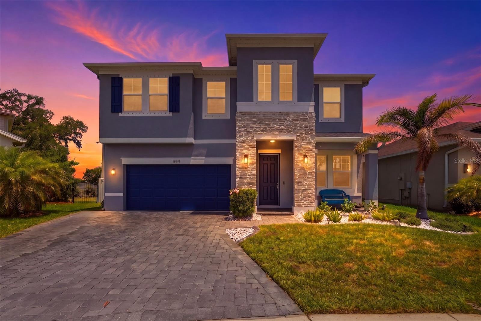 Welcome to 10808 Whitland Grove Drive in Providence Reserve, a gated Riverview community with newer construction homes, a low-maintenance lifestyle and no CDD fees paired with a low monthly HOA. This four-bedroom, three-bath corner-lot home features over 2,600 square feet of living space with an open concept layout designed for entertaining and everyday living, and a wide-open rear view with no neighboring rooflines, one of the most private backyard settings in the community. Go outside to your heated fiberglass saltwater pool and screened lanai, surrounded by upgraded landscaping with palms, a low-maintenance Astroturf yard, privacy fence and custom lighting throughout. The outdoor space was thoughtfully designed for year-round relaxation and entertaining, with an extended driveway and beautifully enhanced curb appeal completing the picture. Inside, major improvements and custom touches make this home stand out. A remodeled pool bath completed in 2025, newer flooring upstairs and throughout the stairs, California built-ins at the primary closet, motion lighting, dimmers in the kitchen, surround sound features, and tubing installed for wiring behind TVs deliver a clean, modern finish. Fresh interior and exterior paint tie everything together. The home also features smart, efficiency-focused upgrades including spray foam insulation, a generator hookup, electric vehicle charger, garage storage racks, updated stair railings, and recent A/C improvements including a new capacitor, starter and motherboard in 2025, offering peace of mind for years to come. Conveniently near shopping, restaurants, entertainment and commuter access to Tampa, Brandon, and MacDill AFB. Residents enjoy proximity to Legacy Trail, Ashton Trailhead and Rothenbach Park for outdoor activities. Built in 2019, this is an upgraded, move-in ready pool home in one of Riverview's desirable gated communities so schedule your showing today.