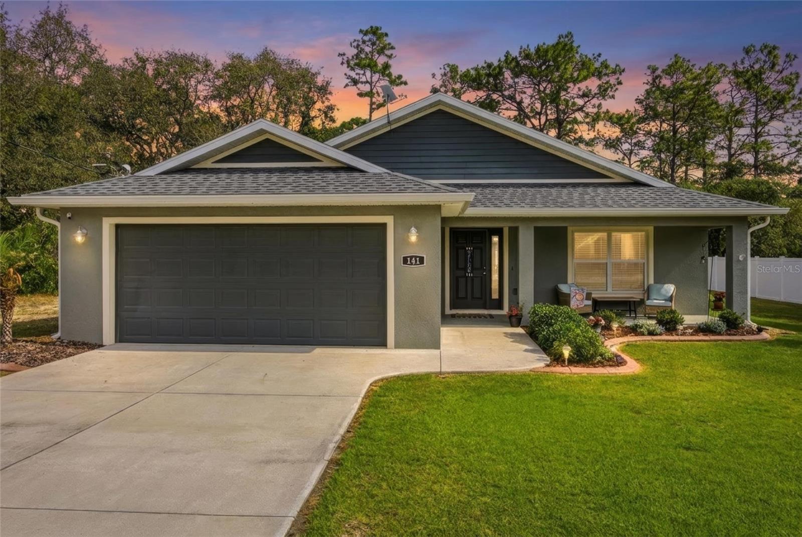 One or more photo(s) has been virtually staged. Welcome to this beautifully maintained 2022 block and stucco home located in Ocklawaha, FL, offering the perfect blend of modern comfort, outdoor living, and peaceful county living with NO HOA fees.
This 3-bedroom, 2-bath home features an inviting open layout that welcomes you from the charming front porch straight into the heart of the home — seamlessly connecting the living room, kitchen, and dining area for easy everyday living and entertaining.
Inside, you’ll find Luxury Vinyl Plank flooring throughout along with granite countertops throughout the home, creating a clean and modern feel. The kitchen is thoughtfully designed with soft-close cabinetry, ample workspace, and excellent flow into the main living areas.
The spacious primary suite features a vaulted ceiling, while the primary bathroom includes a dual vanity sink and a Roman-style shower, offering both comfort and functionality.
Step outside through the French doors with built-in blinds and enjoy your own private backyard retreat. The home features a saltwater pool with a Dolphin brand cleaner/vacuum, all enclosed within a screened birdcage lanai, creating the perfect space for relaxing or entertaining year-round. The backyard is fully surrounded by a vinyl privacy fence for added peace and privacy.
An added bonus — this property is being sold with the additional lot located to the left side of the home when facing the property, offering extra space, privacy, and future possibilities.
Additional features include Starlink internet equipment, ideal for reliable high-speed connectivity while enjoying the benefits of country living.
Conveniently located near local access points for ATV and four-wheeler trails, this property also offers easy access to both Ocala and The Villages for all your shopping, dining, entertainment, and everyday needs.
Move-in ready and loaded with upgrades, this home is a must-see for anyone looking to enjoy the Florida lifestyle without HOA restrictions.