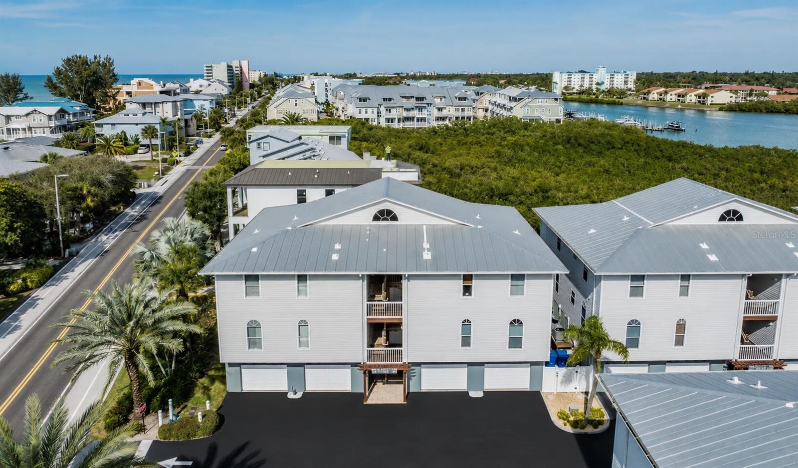 Turnkey Coastal Living with Gulf & Intracoastal Views – Just Steps to the Beach!

Welcome to Mariner's Pointe, one of Indian Shores' most desirable waterfront communities, perfectly situated between the sparkling Gulf of Mexico and the scenic Intracoastal Waterway. This beautifully furnished 2-bedroom, 2-bath condominium boasts approximately 1,390 square feet of bright, open living space and is ready to enjoy from day one—whether as your primary residence, 2nd home retreat, or income-producing investment with weekly rentals permitted.

Perfectly positioned on the third floor, this residence enjoys both Gulf and Intracoastal water views from the private balcony while being the closest building location to the beach—just a one-minute walk to the sand.

The spacious split-bedroom floor plan features high ceilings, an oversized primary suite, generous living and dining areas, and abundant natural light. The home is being sold fully furnished, making your transition to beach life effortless.

Notable upgrades include:

- Brand-new $15,000 HVAC system (September 2024) New water heater (2021)
- Hurricane shutters for added protection and peace of mind
- Attached oversized two-car garage, with private storage room for all your beach chairs, bikes, kayaks, and all your beach gear.
- Ample community guest parking
- Granite countertops
- Fully furnished Condo

Mariner's Pointe is a charming Key West-style community offering resort-style amenities including:

- Heated community pool
- Beautiful fishing dock
- Kayak launch
- Meticulously maintained grounds
- Freshly painted community exterior and New Roof (2025), providing years of peace of mind.

The comprehensive  $1,058/monthly HOA includes Cable, High Speed Internet, water, sewer, trash, community pool, reserve funding, building insurance, exterior and grounds maintenance, management, and recreational facilities, Dock.

Located within walking distance of restaurants, shops, and everything that makes Indian Shores one of Florida's most sought-after beach communities, this is coastal living at its finest.

Don't miss this rare opportunity to own one of the most desirable units in Mariner's Pointe—where sunrise over the Intracoastal and sunset on the Gulf can both be part of your everyday lifestyle.

*Seller welcomes ALL buyers AND realtors.