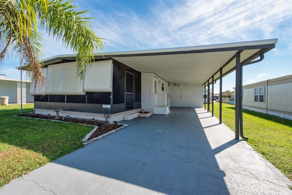 *NO LOT RENT* Low HOA fee of $551/YEAR! Move-in ready and recently renovated, this charming 2-bedroom, 1.5-bath manufactured home in Terrace Park offers comfort, style, and low-maintenance living—all in a vibrant 55+ community where you own the land. Step inside to find fresh updates throughout, including a brand-new roof, updated plumbing, new paint, and modern finishes. The family room welcomes you with new luxury vinyl plank flooring, while the kitchen shines with brand-new white cabinetry, quartz countertops, stainless steel appliances, and a cozy eat-in dining space. The primary bedroom features new flooring, a spacious closet, and an ensuite half bath. A second bedroom also offers new flooring, while the main bath boasts a sleek marble shower, updated vanity, and new toilet. Enjoy relaxing outdoors on the covered, screened-in front patio or under the carport, which also includes a storage shed with laundry hookups. Terrace Park residents enjoy a low HOA fee that covers access to the sparkling community pool, clubhouse, shuffleboard courts, and a calendar of social events. Best of all, there’s no lot rent—you own the land! Located just minutes from Zephyrhills and Wesley Chapel, you’ll love being close to shopping at Wiregrass Mall and Prime Outlets, along with dining, theaters, and top medical centers. This home combines modern updates, community amenities, and a convenient location—making it an excellent choice for year-round living or a seasonal retreat.