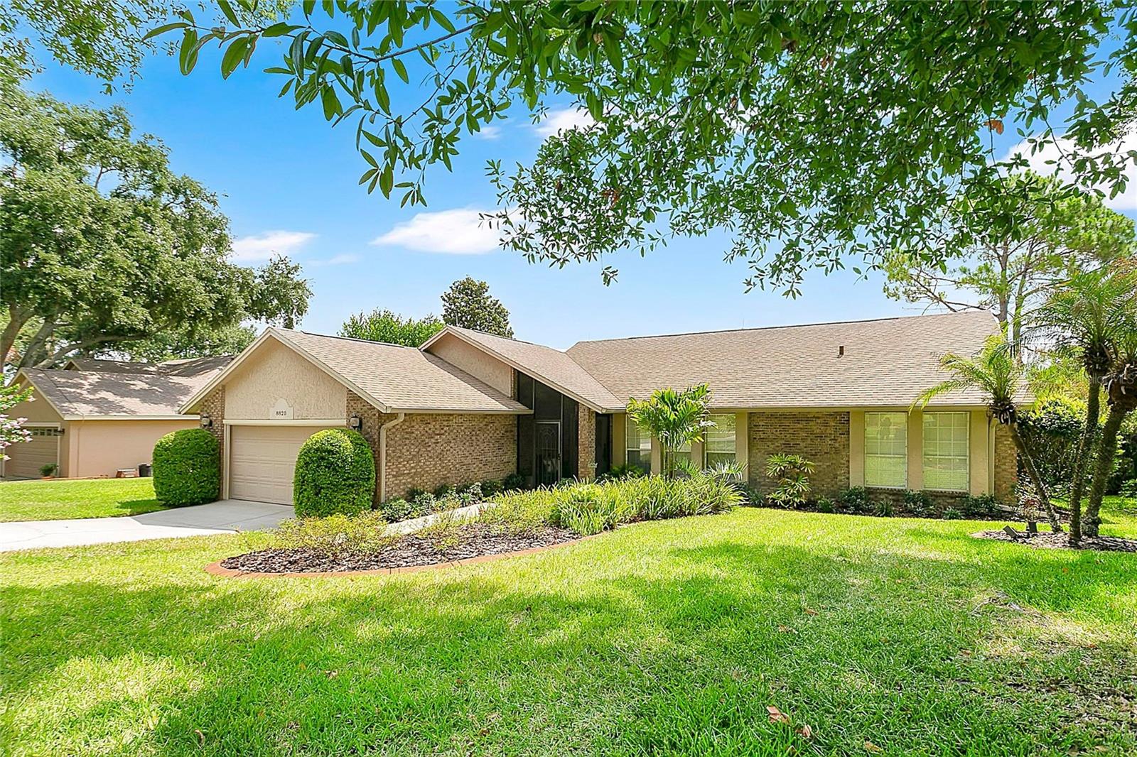 Beautifully positioned along the 7th hole of Green Valley Golf Course, this updated 3-bedroom, 2-bath home offers nearly 2,000 square feet of inviting living space with peaceful golf course and water views, mature landscaping, and an exceptionally low HOA of just $150 per year. Soaring ceilings and abundant natural light create an open, airy feel, while premium wide-plank European white oak flooring throughout most of the home offers a distinctive upgrade rarely found at this price point. The open kitchen flows nicely into the living room and features a sunny breakfast nook and breakfast bar. The flexible floor plan also includes a formal dining room, dedicated office with custom built-ins and a third bedroom currently used as a fitness room, featuring eco-friendly linseed oil flooring. Recent improvements include a brand-new luxury primary shower completed in 2026, updated guest bath, whole-house plumbing re-pipe in 2024, newer HVAC, 2024 water heater, and a Sense smart home energy monitoring system that allows owners to monitor electricity usage throughout the home. 
But the true showstopper is the outdoor living space. Situated on just over a quarter acre with lush landscaping, the elevated covered and screened lanai captures exceptional golf course and water views while offering a sense of privacy.  The golf ball-resistant screen enclosure provides peace of mind, and the refreshing private pool with waterfall feature creates the perfect setting for weekend gatherings, quiet evenings, or simply enjoying Florida's year-round sunshine.  Enhancing the outdoor experience is a custom accent wall featuring an electric fireplace and mounted TV, both included with the home, creating an inviting space for relaxing and entertaining. 
Residents enjoy direct access to the West Orange Trail from the rear of the neighborhood, with the vibrant Historic Downtown Clermont, shopping, dining, waterfront parks, and Lake Minneola just minutes away. Orlando International Airport, Disney World, Universal, major highways, shopping, dining, and healthcare are all within convenient reach. If you've been searching for a home that combines scenic views, outdoor living, neighborhood charm, and an active Central Florida lifestyle, this Green Valley gem is not to be missed.