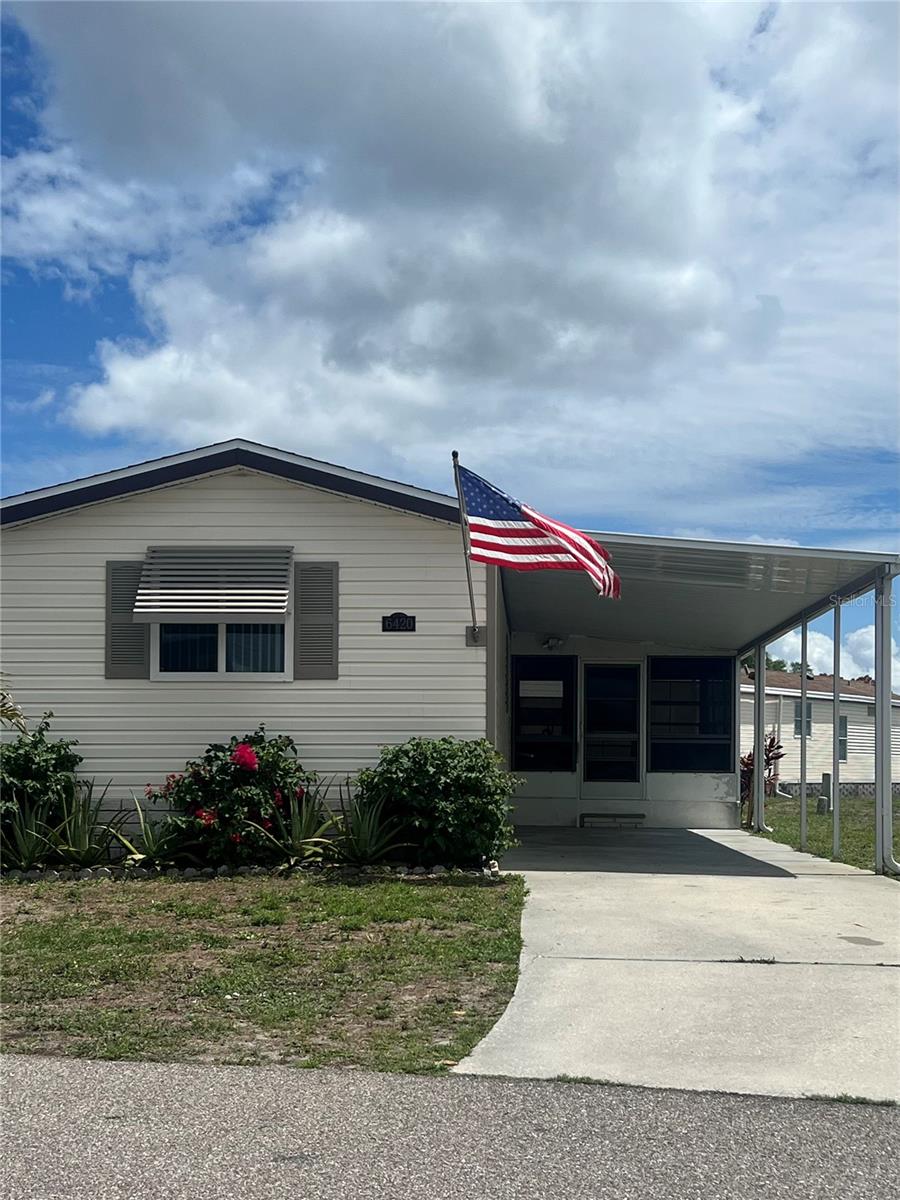 Motivated Sellers! All reasonable offers will be considered. Holiday Park is a 55+ Community where you OWN the land! Nothing to do here at 6420 Haele Court but move right in to this spacious 3 bedroom 2 bath, tastefully furnished inside and out. This home is a very well maintained and updated 1988 beauty!! Pride of ownership shows up in all the attention to details. Strong 1/2" plywood wrapped in vinyl siding, hurricane windows, new architectural shingle roof in 2022, flooring not only has newer waterproof laminate throughout the home but the majority of the home also has been updated to a 3/4" plywood sub-flooring plus new insulation and also a sub-floor vapor barrier was installed in 2026 in the majority of the home. Both bathrooms have had a make over with new shower stalls, sink and cabinetry. Stunning kitchen was remodeled in 2022 with stainless appliances, lovely cabinetry and fabulous farm sink!
In Holiday Park you own the land with a deed, and your $195.00 monthly maintenance fee ($2340.00 a year) is included in your taxes. The community features 2 clubhouses, 2 swimming pools, a library, a fitness room, tennis courts, pickleball & bocce courts, to name a few. You are close to shopping, dining, entertainment, numerous golf courses, sports facilities, and SW Florida's renowned beaches. Come take a look!