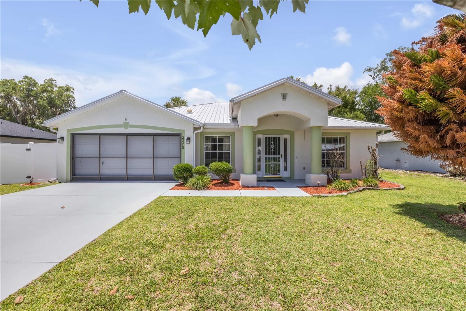 One or more photo(s) has been virtually staged. Smart Florida Living With Space, Freedom, and Value.  Welcome to 2226 Juniper Dr, where practical upgrades and everyday comfort come together at a price point that makes sense. Built by Holiday Builders, this 3-bedroom, 2-bath home offers a smart split floor plan that gives the primary suite its own sense of privacy, while vaulted ceilings make the main living areas feel open, airy, and easy to enjoy.
The metal roof adds long-term value and is a major advantage in Florida, offering durability and potential insurance benefits buyers will appreciate. With no HOA, you can enjoy fewer monthly expenses and more flexibility for how you use your property. The 80x125 lot provides plenty of outdoor space for gardening, entertaining, pets, or parking a boat, trailer, or RV.  A 2-car garage, generous yard, and well-designed layout make this home a strong option for anyone looking for comfort without overcomplication. Schedule your private showing and see why this Edgewater home deserves a closer look.