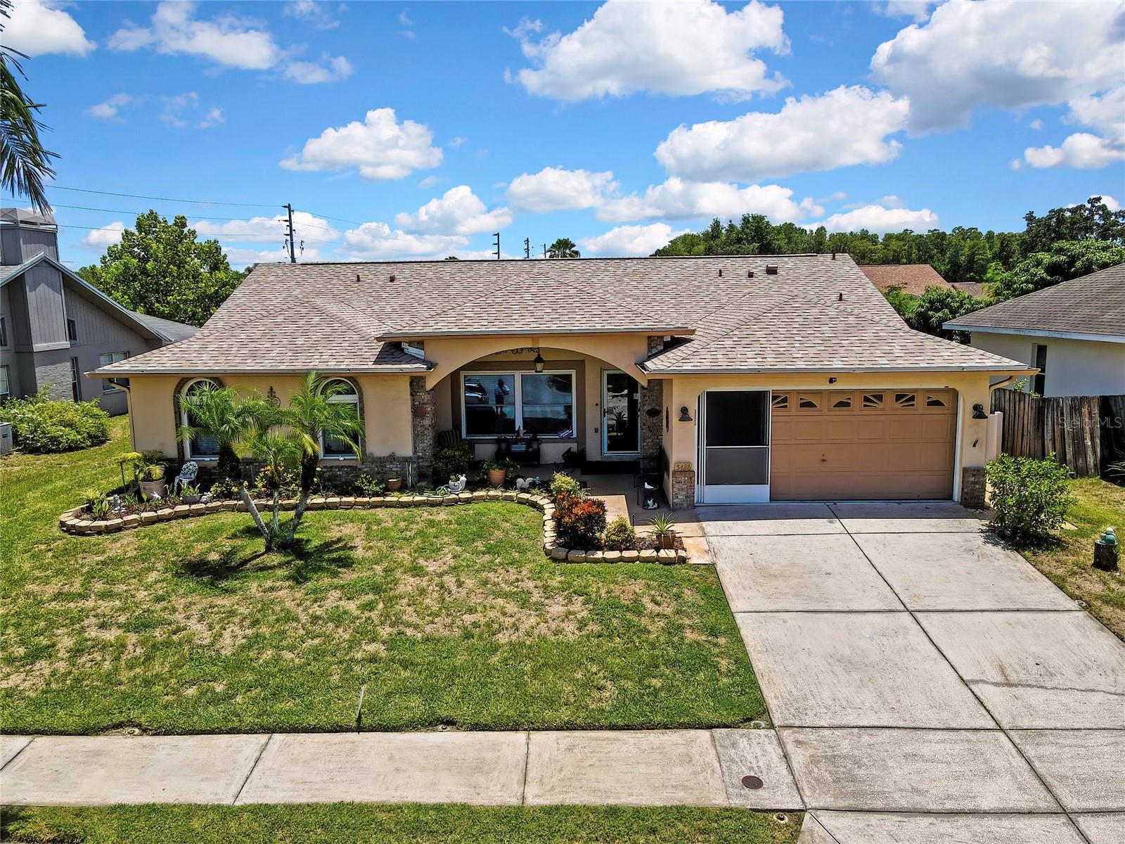 Big beautiful pool home located in the desirable community of HUNTERS RIDGE!! . This fabulous property boasts  ALL THE BIG FIXES !! 
BRAND  NEW ROOF ( JULY 2026), , BRAND NEW  A/C , FULL SYSTEM WITH HEAT PUMP! ( JULY 2026),  FRESH INTERIOR PAINT ( 2025) , NEW LUXURY VINYL PLANK FLOORING THROUGHOUT ALL COMMON AREAS! ( 2024), NEW FRENCH DOORS TO THE LANAI ( 2025). ALL BATHROOMS HAVE BEEN UPDATED WITH SOLID WOOD CABINETS AND STONE SURFACE COUNTRTOPS! This beauty features an open , light bright and airy layout! PRIMARY BEDROOM ENSUITE  IS TREMENDOUS  and features  an updated solid wood  double sink vanity, private toilet closet and a walk in all tile shower!  The remaining  3 bedrooms are  a good size Queen/full, fully tiled and  freshly painted! Our beautiful lanai and  cool deck was just resurfaced and overlooks a tremendous yard that is fully enclosed in new white vinyl fencing with  two full entry gates for landscaping ease!! Absolutely Perfect for entertaining and family fun! The irrigation system runs off its own well, keeping things green while cutting water  bills to a fraction of the cost!  This is prime New Port Richey, Highly rated schools. top of the line shopping , 30  minutes to Tampa and our beautiful Clearwater beaches!  Also only 10 Minutes to Downtown New Port Richey and all its Parks, restaurants , and festivities! Come take a look, its a must see!