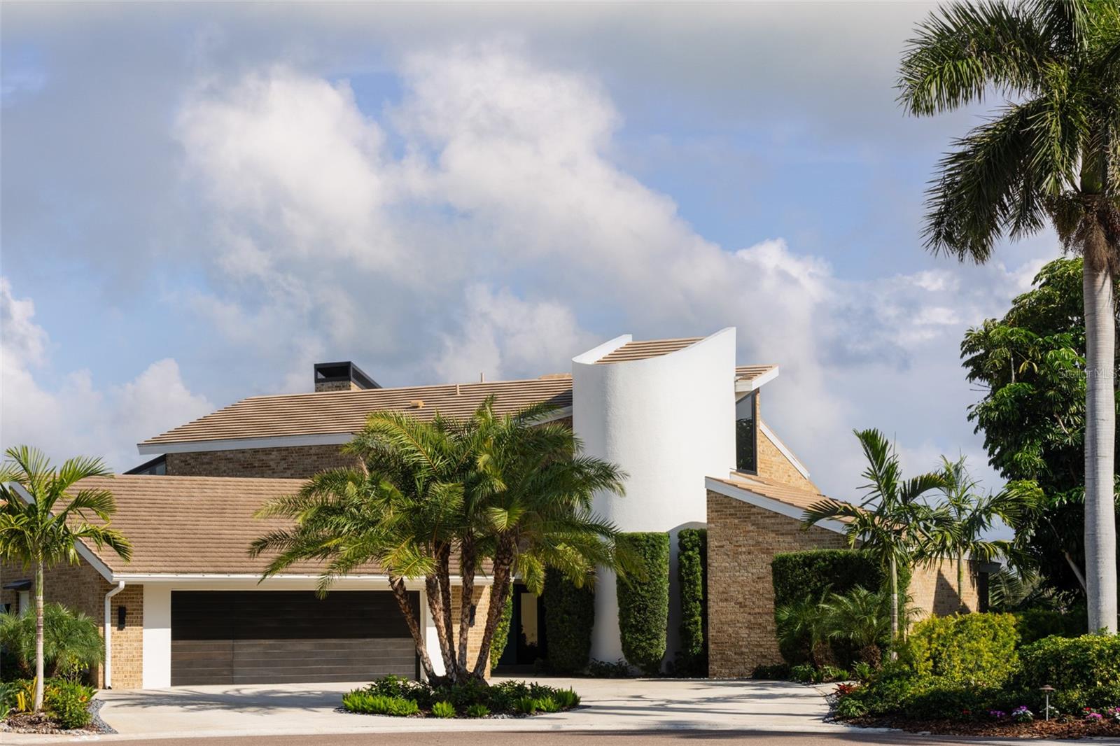 A rare architectural jewel where every room captures breathtaking views, this Bayway Isles
estate is both a Mid-Century Modern masterpiece and a serene retreat. Reimagined in 2023 by
acclaimed designer Lisa Gilmore, every element of the extensive renovation was curated with
intention, blending bold style and sophistication with modern comfort, safety, and
convenience. Featured in Florida Design and showcased by Architectural Digest, the home
reflects the perfect balance of architectural significance and contemporary luxury.
Seven sets of expansive impact-rated glass doors frame 161 feet of waterfront, uniting modern
protection with a design that invites the outdoors in. Outside, lush tropical landscaping,
expansive waterfront terraces, an outdoor speaker system, and a sparkling pool and spa make
this home the perfect luxury retreat and an entertainer’s dream.
Inside, soaring vaulted ceilings and exquisitely composed spaces strike a balance of drama and
refinement. The chef’s kitchen is a true centerpiece with bespoke cabinetry by T2theS, a
custom brass bar, and a hidden door that leads to an oversized mudroom and pantry. The
primary suite boasts a private glass atrium that immerses you in nature and reflects the
glistening water, paired with a spa-like bathroom featuring a jetted steam shower and soaking
tub. Each of the four bedrooms and four-and-a-half baths has been expertly curated to make
every space feel special.
Additional highlights include hurricane-rated windows and doors, a state-of-the-art movie
room, custom cabinetry, and in-ceiling speakers that extend to the outdoor living areas. Voice-
activated Lutron Caséta lighting, automated window shades, and a fully integrated smart
speaker system ensure effortless control throughout. Two private slips with power provide
deep-water, no-bridge Gulf access via 30,000- and 9,000-lb lifts, making this property a true
boater’s paradise.
Set within Bayway Isles, a 24/7 guarded community, just minutes from downtown St.
Petersburg and the beaches, this home offers both tranquility and convenience. More than a
residence, it is a statement of vision, artistry, and refined modern living. Schedule your private
tour today.