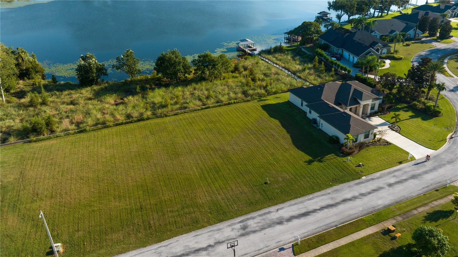 JUST REDUCED!!! SOUTHEAST WINTER HAVEN! BUILD YOUR LAKEFRONT DREAM HOME ON THIS GORGEOUS LAKEFRONT BUILDING LOT IN THE GATED COMMUNITY OF MILLER'S LANDING WITH 100 FT. ON LAKE BESS! Views! Views! Views! Hurry before it's long gone!