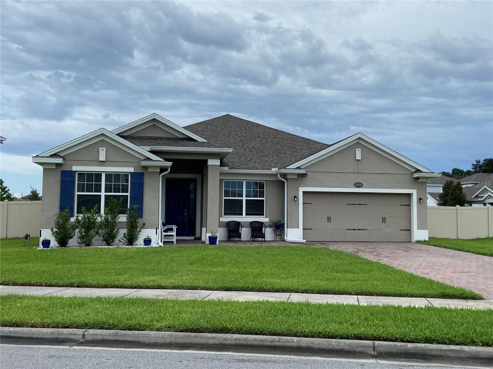 Welcome home to Sanctuary at Twin Waters — one of Winter Garden's most sought-after communities! This beautifully designed 2020-built home offers soaring high ceilings, tile throughout, and a wide open floor plan that instantly makes you feel at home.
The heart of the home is the stunning kitchen, featuring a massive island with rich granite countertops and gorgeous 42-inch Espresso cabinets — perfect for gathering and entertaining. Whether it's a casual morning in the eat-in nook or a formal dinner with guests, this home was built for making memories.
With a versatile bonus room and a luxurious owner's retreat tucked away in the back for ultimate privacy, there is space to truly live. The spa-like ensuite features a soaker tub, subway-tiled shower, dual sinks with quartz counters, and a generous walk-in closet — your own personal sanctuary at the end of every day. Even the water feels different here, thanks to a whole-home purification system.
A rare find in Central Florida — this is a gas community, adding both value and everyday convenience. The garage features a mini split AC unit, keeping the space cool and comfortable year-round — perfect for a workshop, home gym, or hobby space. Step outside to your fully fenced, spacious corner lot with a covered porch and plenty of room to add your dream pool.
The community itself offers so much to love — a pool, fishing dock, playground, and picnic area, plus breathtaking views of Lake Avalon right in the neighborhood. This is more than a home — it's the lifestyle you've been waiting for. Come see it and stay forever.