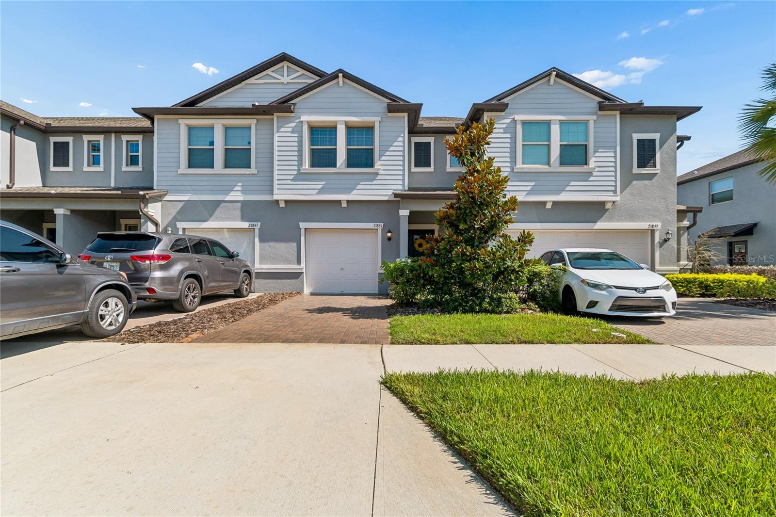What the new builds simply don't include, this home has it all! Fully screened in patio. Crown moulding throughout. A stunning custom kitchen backsplash. HOA that includes water. A sealed paver driveway. These are details that elevate everyday living, and they come standard here. Perfectly positioned within the community, just a short walk to the elementary school and sitting between two amenity centers, including the brand new Conner House, this beautifully maintained 3 bedroom, 2.5 bathroom townhome offers move in ready living in one of the most desirable locations the neighborhood has to offer. Step inside to find fresh interior paint, upgraded appliances, and a home that has been cared for with genuine pride. Every detail has been considered, and it shows. A 1 car garage completes a package that is genuinely difficult to match at this price point. Ask about our preferred lender offering closing costs, keeping more money in your pocket from day one.