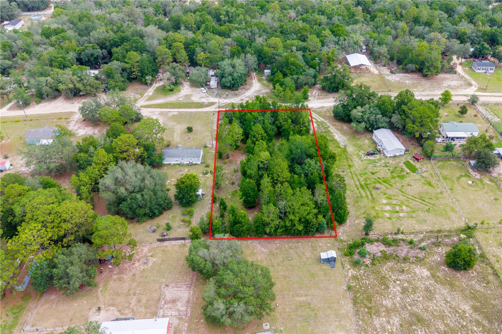 Enjoy 1.25 acres of North Central Florida living with the convenience of being just minutes from everyday amenities and some of the area's most popular destinations. Located in Bronson, this property is approximately 15 minutes from Williston, 25 minutes from Gainesville, and within easy reach of Devil's Den, Blue Grotto, Rainbow Springs, Manatee Springs, Cedar Lakes Woods & Gardens, and countless opportunities for outdoor recreation. Whether you're planning a future homesite or looking for an investment property, this parcel offers a rural setting while remaining close to shopping, dining, schools, medical facilities, and major roadways.