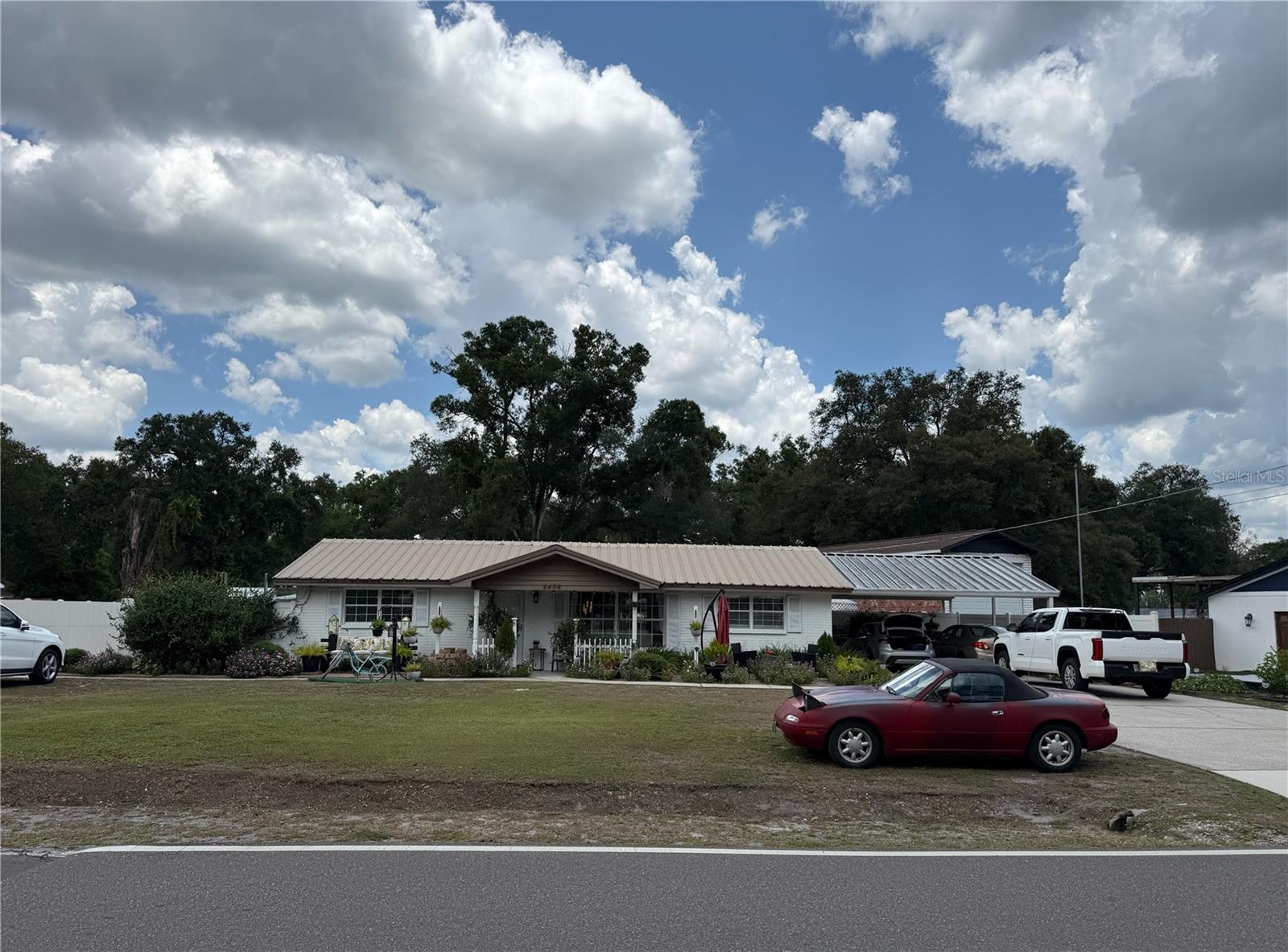 Come discover Eureka Springs Road, offering a rural feel in the heart of Tampa while remaining close to all conveniences. This property features a large 0.41-acre lot with no HOA, no CDD, and no deed restrictions.

This 3-bedroom, 1-bath home has  a fresh, modern color palette sets the tone for the bright and open living and dining areas, complemented by oversized tile flooring for easy maintenance. doors provide direct access to the patio, enhancing indoor-outdoor living.

The updated kitchen showcases desirable cabinetry, granite countertops, a window over the sink bringing in natural light, and a breakfast bar for casual dining.

The fully fenced backyard offers additional privacy and functionality, with a gated area providing extra workshop and storage options in addition to the 3-car garage.

Conveniently located just minutes from I-4 and I-75, this home provides easy access to shopping, dining, entertainment, and parks. Hillsborough Bay is less than 30 minutes away—bring your boat and enjoy everything in the area.

This is the perfect property for all your hobbies and lifestyle needs. Schedule your private showing today.