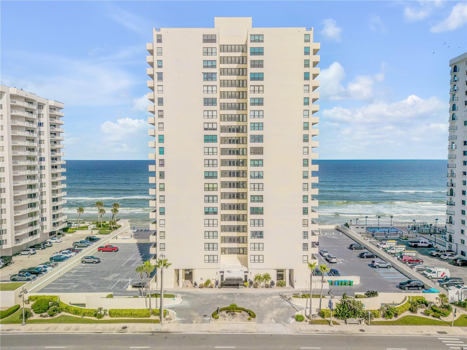Direct oceanfront condo home with breathtaking ocean views can be yours! This fully furnished, upgraded home on the 11th-floor sits on the pristine white sands of Daytona Beach Shores. This showstopping 2-bedroom, 2-bathroom residence spans 1,200 square feet and comes fully furnished with high-end finishes throughout. Recent updates include kitchen and bathrooms, $40,000 worth of hurricane-rated windows and sliders in 2023, remote-control blinds, 2021 hot water heater, and luxury vinyl flooring throughout - every detail carefully designed to enhance both style and comfort. The gourmet kitchen is a true centerpiece, featuring cabinetry with elegant rope detailing, granite countertops, stainless steel appliances, a gooseneck faucet, recessed lighting, and a spacious island that opens to the living area making it perfect for entertaining or family gatherings. Both bedrooms offer uninterrupted ocean views, while the master suite includes a fully tiled bathroom with wood cabinetry, granite counters, and a sleek glass-enclosed shower. This pet-friendly condo (1 pet up to 25 lbs) is part of the highly desirable Oceans Five community, offering premium amenities such as a heated outdoor pool with an expansive sun deck, BBQ area, shuffleboard courts, saunas, social room, fitness center, beautifully appointed library, pool table lounge, private storage, underground parking, and direct beach access. Ideally located near shopping and restaurants and within minutes from the iconic Ponce Inlet Lighthouse, this is coastal living at its finest. This rare opportunity will not last long, schedule your showing today!