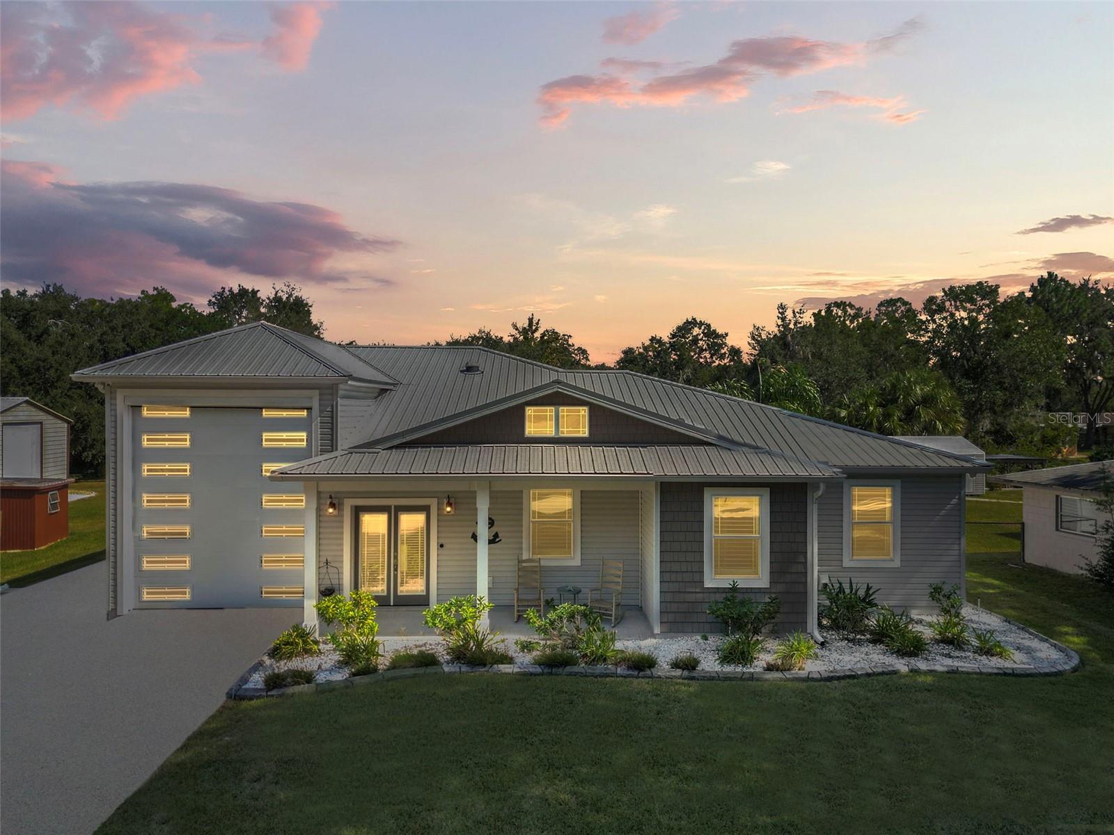 SPECTACULAR custom built home with access to famous Harris Chain of Lakes! This home was thoughtfully designed to accommodate all the amenities of Florida living. Keep your home away from home safely parked in this oversized, attached RV garage. This space is fully equipped with 50amp electrical hook up and dump out, plenty of room for other equipment, golf carts, motorcycles, and even 2 seating areas for an indoor/outdoor living space. Inside, warm wood look tile covers the main living area and bedrooms. This kitchen is an absolute dream! Stunning granite countertops really make the huge island pop! Tons of custom cabinetry space every where you turn, black stainless Samsung appliances, eye catching backsplash, and fabulous lighting will make you the host with the most!
Two spacious bedrooms share a large Jack-and-Jill bathroom. Master suite is bright and roomy with access leading out to the pool deck. And lets talk about this backyard oasis! Swim up bar in a beautifully lit and heated pool, sitting area with gas burning fire pit, and even your own TIKI HUT! Imagine friends and family sitting beneath the rustling palm fronds while you prepare a steak dinner, or even a big ole' seafood boil on the specialty cooking area, able to accommodate the biggest of feasts! Just beyond the screened in pool deck, head to the boat house complete with power, lift, and safely secured with a new sea wall. Take a leisurely canal cruise out to Lake Harris for breath taking sunsets, fishing galore, and all kinds of fun in the sun! Travel the lakes town to town checking out popular dinning and entertainment. Other features of this one of a kind home include, additional RV hook ups outside, lifetime metal roof, shed with power, security, professional landscaping with irrigation, lighting, and lovely curbing around flower beds. Spray in insulation, Tankless water heater, and a 500 gallon in ground propane tank. The neighborhood is lovely, well established, and deemed a bird sanctuary, NO HOA!!! This home is truly a Sunshine State star and won't last long! Call for your private tour today!