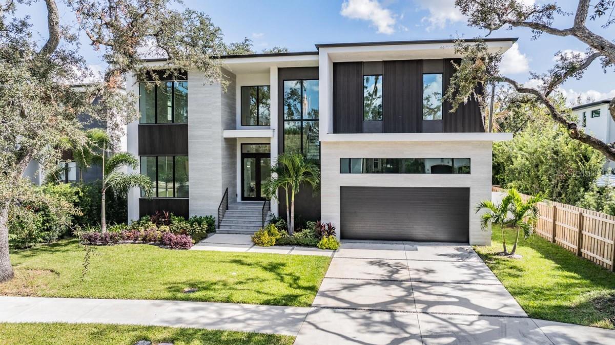 **Exquisite Custom-Built Estate in South Tampa’s Coveted Beach Park**

Experience unmatched luxury in this story block custom home, perfectly positioned in Beach Park, one of Tampa’s most prestigious neighborhoods. Just minutes from Tampa International Airport, International Plaza, and the city’s best dining and entertainment, this residence offers the ultimate blend of sophistication and convenience.

This one-of-a-kind home features five expansive bedrooms, five elegant bathrooms, and a versatile bonus room ideal for a home theater, game room, or personal retreat. The interiors are a testament to modern elegance, with 48x48 porcelain floors and luxurious porcelain countertops that surpass the finest quartz alternatives. The gourmet kitchen, outfitted with high-end Dacor appliances and custom cabinetry, is both stylish and functional.

Designed for grand entertaining and intimate gatherings alike, the open-concept living space showcases an illuminated glass wine display and dry bar, creating a stunning focal point. Flooded with natural light, this home seamlessly blends indoor and outdoor living.

This property isn’t just a home—it’s a lifestyle of comfort, elegance, and exclusivity. Don’t miss your opportunity to own this rare gem in Beach Park. Schedule your private showing today.