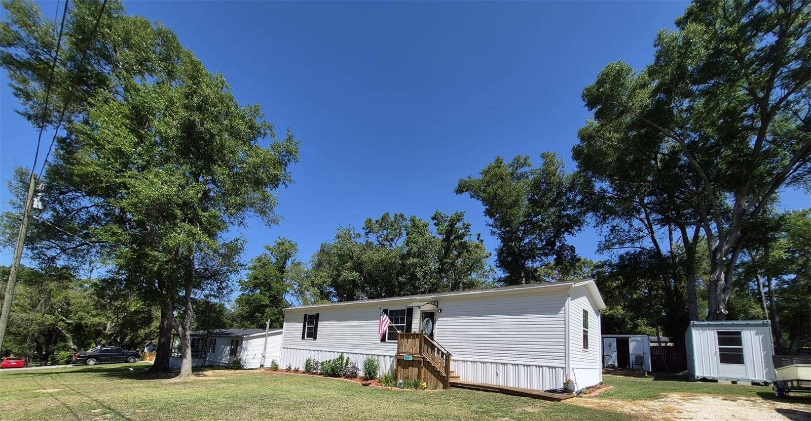 Motivated owner open to reasonable offers.Almost new 2024 manufactured home situated on a spacious 0.23 acre lot in Inverness! This well-designed 2 bedroom, 2 bath home (approximately 960 sq. ft.) offers a functional split floor plan with an open concept living, dining and kitchen area that is perfect for comfortable everyday living.
The home features modern finishes, energy-efficient systems and a bright interior with great natural light. Enjoy the convenience of a newly installed home (2024 setup) with updated systems throughout, giving peace of mind for years to come.
Outside the property provides plenty of space for parking, storage, or future additions, 2 storage sheds are already in place, and the lot offers flexibility with no HOA restrictions.
Disclaimer: One or more photos may be AI-generated or digitally enhanced for illustrative purposes.
Located on a paved road in a quiet area, yet just a short drive to shopping, dining and all that Inverness has to offer.