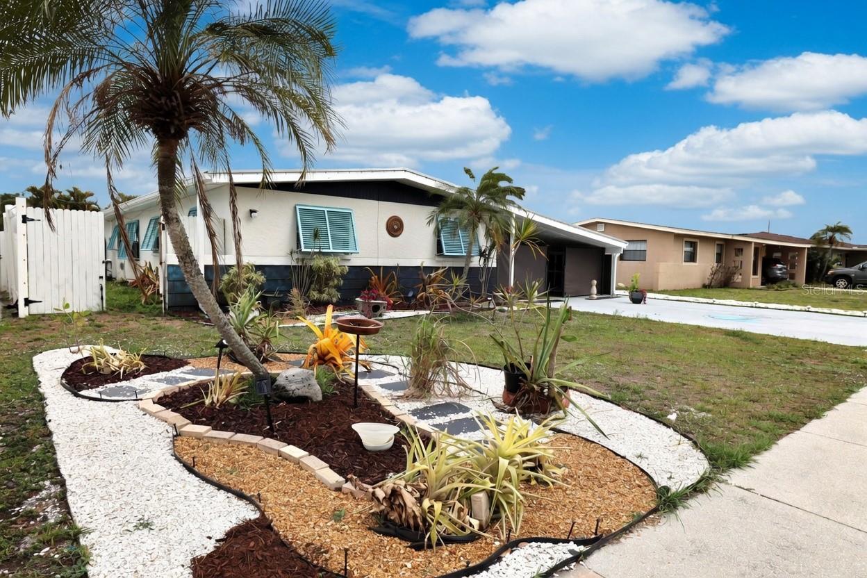 Virtually Staged. Spacious and beautifully updated 5-bedroom, 2-bath pool home in the heart of Sarasota—offering no deed restrictions. 

This fully rehabbed home welcomes you with a bright living room featuring stunning designer metallic flooring. The flexible 5th bedroom is currently used as a home office, perfect for today’s lifestyle. Major updates include a metal roof (2012) and new HVAC system (2025) for peace of mind.

The kitchen shines with new appliances, designer-added storage units, and a striking palm frond tile backsplash, creating both style and functionality. The dining room features a built-in closet with a charming barn door closure.

Enjoy added convenience with an indoor laundry room equipped with a tankless water heater. The home is fully fenced for privacy and includes ample outdoor storage, along with new Hurricane shutters throughout for enhanced curb appeal.

Step outside to your private pool area—ideal for relaxing or entertaining.

This home is being sold partially furnished, making it move-in ready.

Centrally located near the interstate, hospitals, medical facilities, shopping, and a wide variety of dining options.

A rare opportunity to rent a 5-bedroom pool home in Sarasota