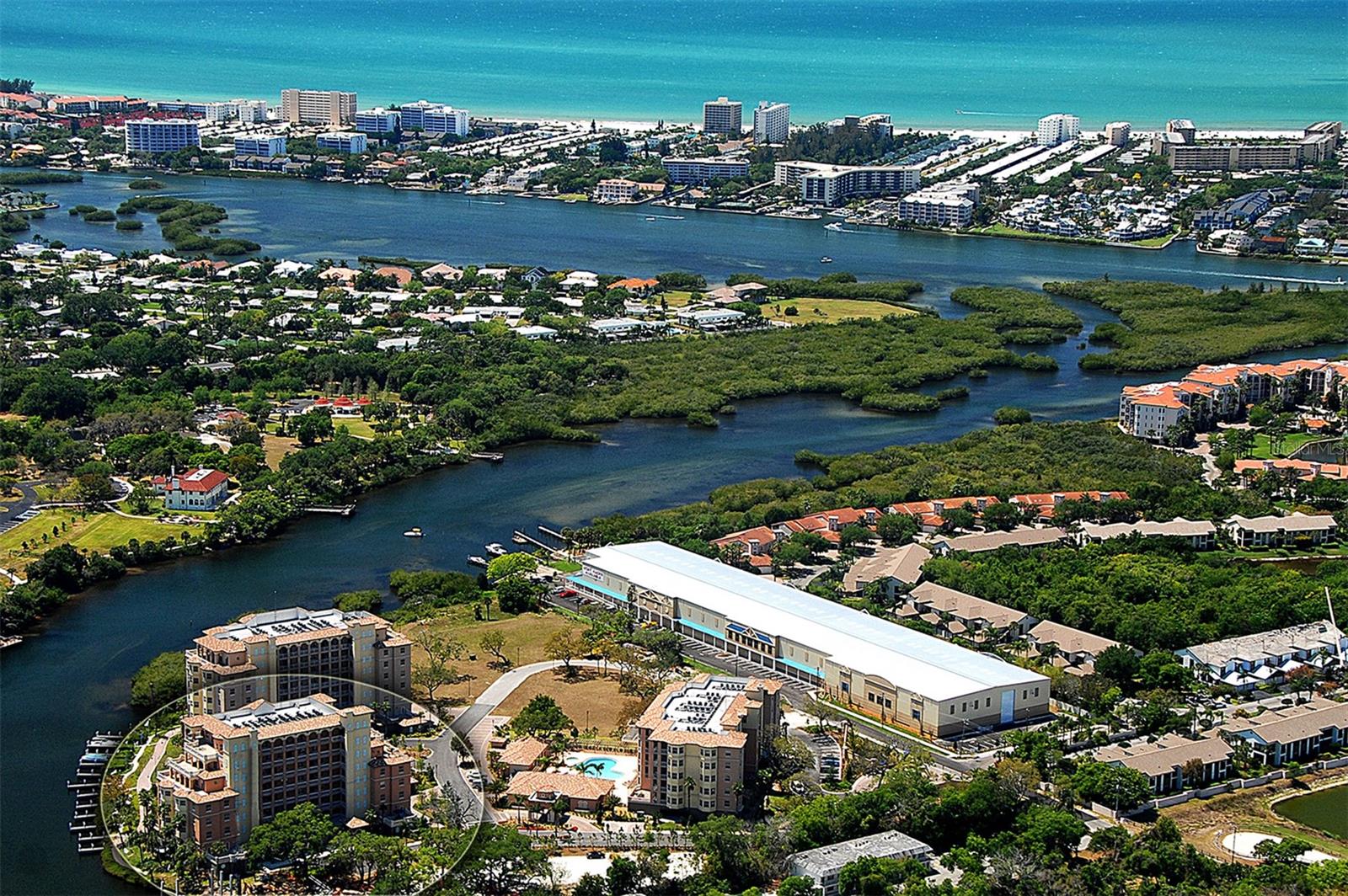 INCREDIBLE VALUE - this beautifully remodeled third-floor luxury residence with water view in the gated waterfront community of Phillippi Landings is perfectly situated West of the Trail and just minutes to the world-renowned beaches of Siesta Key. Nestled along the Phillippi Creek with direct access to Sarasota Bay and just minutes to the Philippi Farmhouse market and the Landings Shopping Center with its vast array of dining and shopping options. This 2 bedroom plus den, 2 bath condo offers the ideal blend of privacy, convenience, and resort-style living. NEW 2026 AC! From the moment you enter via direct elevator access to your private foyer entrance, you are welcomed by an open and airy floor plan, porcelain tile flooring, and an inviting coastal aesthetic. The beautifully updated kitchen features granite countertops, stainless appliances, and rich wood cabinetry, offering both style and function for everyday living and entertaining. Step into the spacious living area that opens to a private covered and screened balcony with peaceful water view, ideal for enjoying morning coffee or a glass of wine at sunset. The split-bedroom layout offers exceptional privacy, with two generously sized bedroom suites. The primary suite is a true retreat, offering tranquil water view, two large walk-in closets, and a spa-style bath with a jetted soaking tub, custom walk-in shower, and private water closet. A flexible bonus space off the main living area provides the perfect nook for a home office, den, reading lounge, or secondary dining area. Impact doors and windows throughout. Beautiful wood plantation shutters. Enjoy the convenience of under-building assigned parking and a private storage unit. This home is move-in ready and ideal as a primary residence, seasonal escape, or investment opportunity.  A boat slip may be available to purchase separately.  Life at Phillippi Landings is exceptional - the community is 10 acres and offers a resort-style heated pool and spa, a well-equipped fitness center, clubhouse, and an expansive waterfront promenade perfect for evening strolls beneath swaying palms. For boating and nature enthusiasts, the community provides kayak launch access and private storage racks—an invitation to explore the peaceful waterways of Phillippi Creek and beyond. The lush, manicured grounds and tropical landscaping create a tranquil, private atmosphere while placing you just minutes from Southside Village, downtown Sarasota, and the vibrant shopping and dining of UTC Mall. This exceptional location, paired with a refined, low-maintenance lifestyle, offers the best of coastal Florida living.