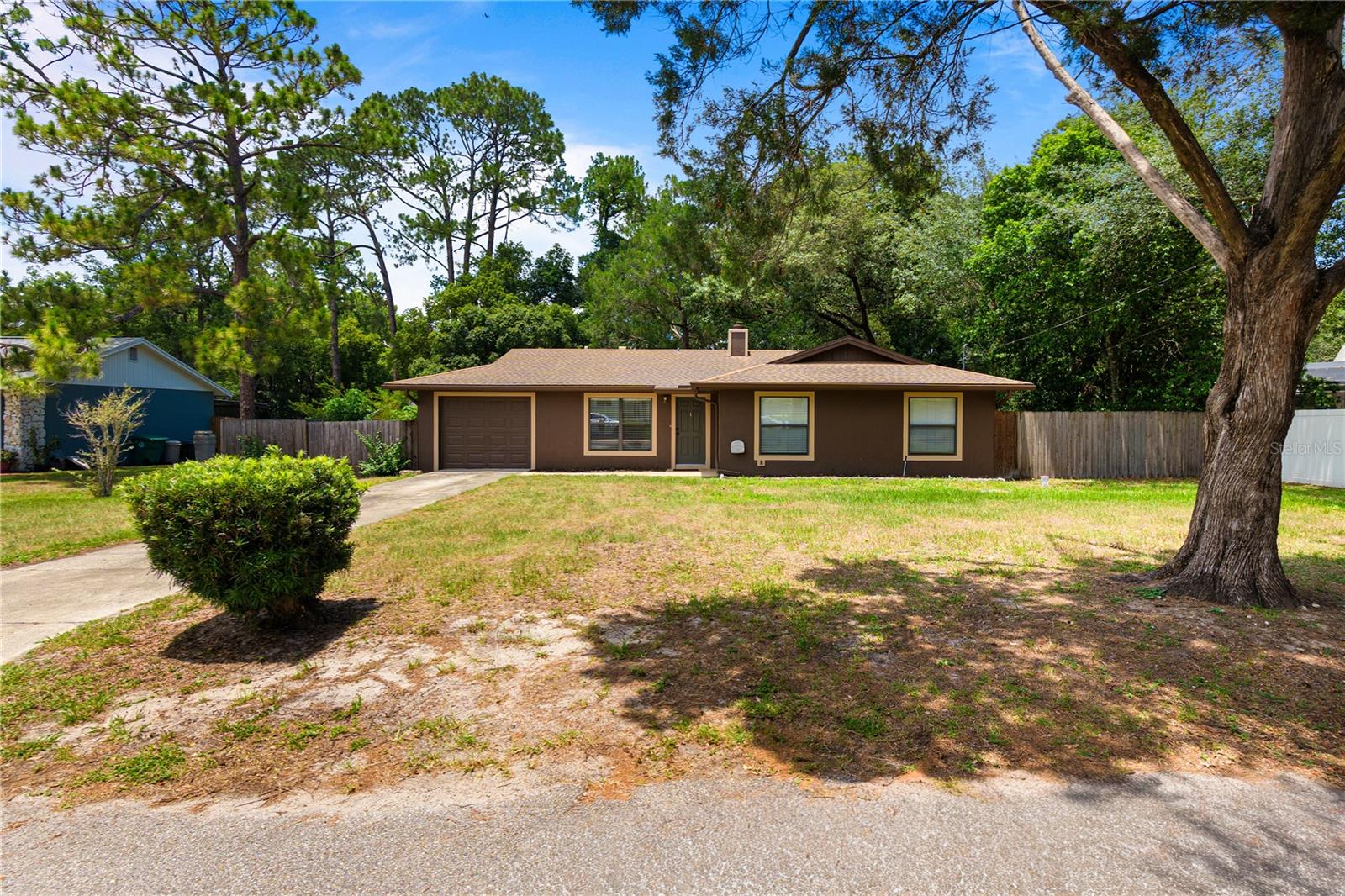 WELCOME HOME! This charming property on OVER 1/2 ACRE is tucked away on a quiet dead-end street in the heart of Lake Mary. Offering privacy, minimal through traffic, and NO HOA restrictions, this property provides the perfect blend of comfort, convenience, and outdoor space for families and individuals alike.

Situated on an oversized fenced backyard overlooking Crystal Lake, the property offers potential for future lake views, access and waterfront enjoyment. While the shoreline area is currently heavily wooded and would require clearing to establish direct access, the setting provides a unique opportunity for those seeking additional outdoor possibilities and a natural backyard backdrop. The property also features a back patio and an additional cement pad in the backyard, offering endless possibilities for outdoor entertaining, recreation, storage, or future improvements.

Inside, you'll find several recent updates including a newer A/C system, newer water heater, and a brand-new dishwasher and stove! The home also features a cozy wood-burning fireplace. Conveniently located near shopping, dining, parks, and major commuter routes, the property offers easy access to everything Lake Mary and the surrounding area have to offer. Zoned for Crystal Lake Elementary, Millennium Middle School, and Lake Mary High School.

Seller is offering a $10,000 credit that may be applied toward a new roof or the buyer's closing costs and prepaids, giving purchasers added flexibility to customize the home or reduce out-of-pocket expenses.

Whether you're looking for privacy, outdoor space, or a centrally located Seminole County address, 214 E Floyd Street offers a rare combination of location, updates, and future potential.