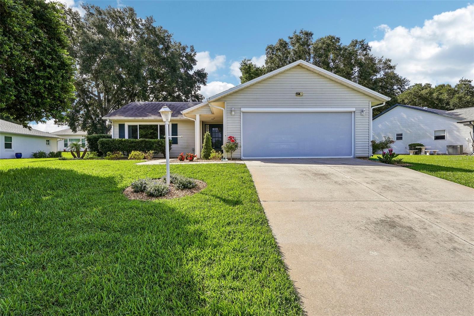 **Live the Florida lifestyle you've been dreaming of in this beautiful 3-bedroom, 2-bath home located in the highly desirable Highland Lakes, a premier 55+ gated community in Leesburg!**

This well-maintained home offers a bright and inviting floor plan designed for comfortable everyday living and effortless entertaining. The spacious living and dining areas flow seamlessly together, while the well-equipped kitchen provides ample cabinet and counter space. The generous primary suite offers a peaceful retreat, complemented by two additional bedrooms perfect for guests, hobbies, or a home office.

Step outside to the screened back porch, where you can enjoy your morning coffee, relax with friends, or unwind while taking in the peaceful surroundings—an ideal extension of your living space.

Life in Highland Lakes is all about enjoying an active, resort-style lifestyle. Residents have access to outstanding amenities, including indoor and outdoor swimming pools, a state-of-the-art fitness center, tennis and pickleball courts, softball, bocce, walking trails, craft and woodworking studios, a library, RV and boat storage, and a beautifully appointed clubhouse with countless clubs, activities, and social events. Whether you're looking to stay active, pursue new hobbies, or simply enjoy the company of neighbors, Highland Lakes has something for everyone.

Conveniently located near shopping, dining, golf courses, healthcare, and the scenic Harris Chain of Lakes, this home offers the perfect balance of relaxation, recreation, and convenience.

Come experience why Highland Lakes is one of Central Florida's most sought-after active adult communities. Schedule your private showing today!
