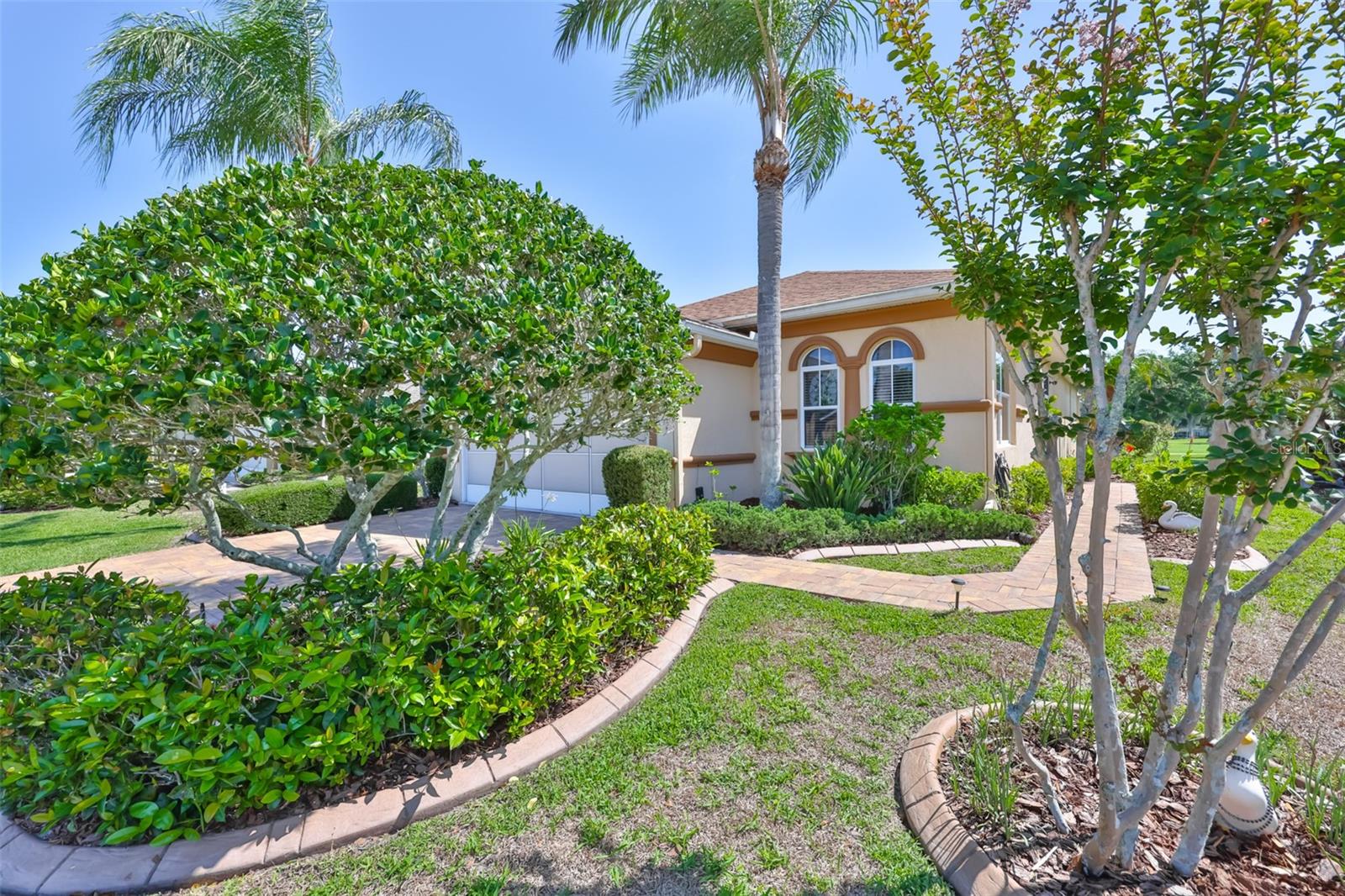 WOW! This is a fabulous, spotless, waterfall pool home overlooking the Caloosa Golf and Country Club. With a nice open floor plan that is perfect for entertaining. The island kitchen is nice and spacious with corian countertops and  newer stainless steel appliances. The outside landscaping is beautiful, colorful and meticulously maintained, you can't find a weed if you search for it. The screened in pool with a dining 
area is so relaxing and inviting with the stunning view, perfect for entertaining. The roof is five yrs old, AC is 6 years old, Hot water is 1.5 years old. The dining room table/ hutch and outside table and chairs are included in sale. The garage door is equipped with a sliding screen.
The Sun City Center Community offers so much right here for active seniors. The activities offered are wonderful , clubs, social, sports, dancing, restaurant, workout room, clubhouse and so much more. You must have your agent give you the grand tour. This is a golf cart friendly community, drive to Walmart, shopping, Dr and more on your cart.
The location is a short drive to St Pete, Tampa, Sarasota, theater, arts and famous beaches, Disney is only a 90 minute drive.