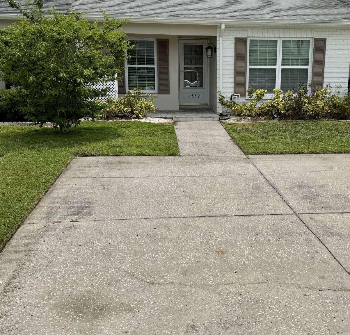 This lovely 2/1 villa is totally renovated and turnkey. Front of unit has pavered front porch big enough for a small table and chairs. All windows were upgraded and new high efficiency AC. New Water heater. Most of the appliances are new or newer. Washer/dryer in unit. Kitchen has beautiful quartz countertops and white shaker cabinets, new fridge and dishwasher. Matching tiled floors throughout. Very nice sized bath with great tiled shower. Huge living/dining room combo. All new lighting and light switches and electrical sockets, including ceiling fans. New base moldings. freshly painted and ready to move in. The main bedroom has a his and hers closets. 2 inch blinds in both bedrooms. The back of the unit has a separate screen room with huge storage closet, it's also got a tiled floor. Out back you'll find a nice sized cement patio for lounging and bbq's. This unit is located in Veterans Villas III. HOA ONLY $50.00 PER MONTH! THAT PAYS FOR TRASH AND LAWN SERVICE. This property can be purchased as a rental also, in fact thats how current owner used it. It's got a two car parking pad out front. This unit is 3 minutes fro HWY 54. 40 minutes to Tampa Airport. 15 minutes to beaches. 5-10 minutes to grocery stores and big box stores. Folks this is a very clean unit and its move in ready!