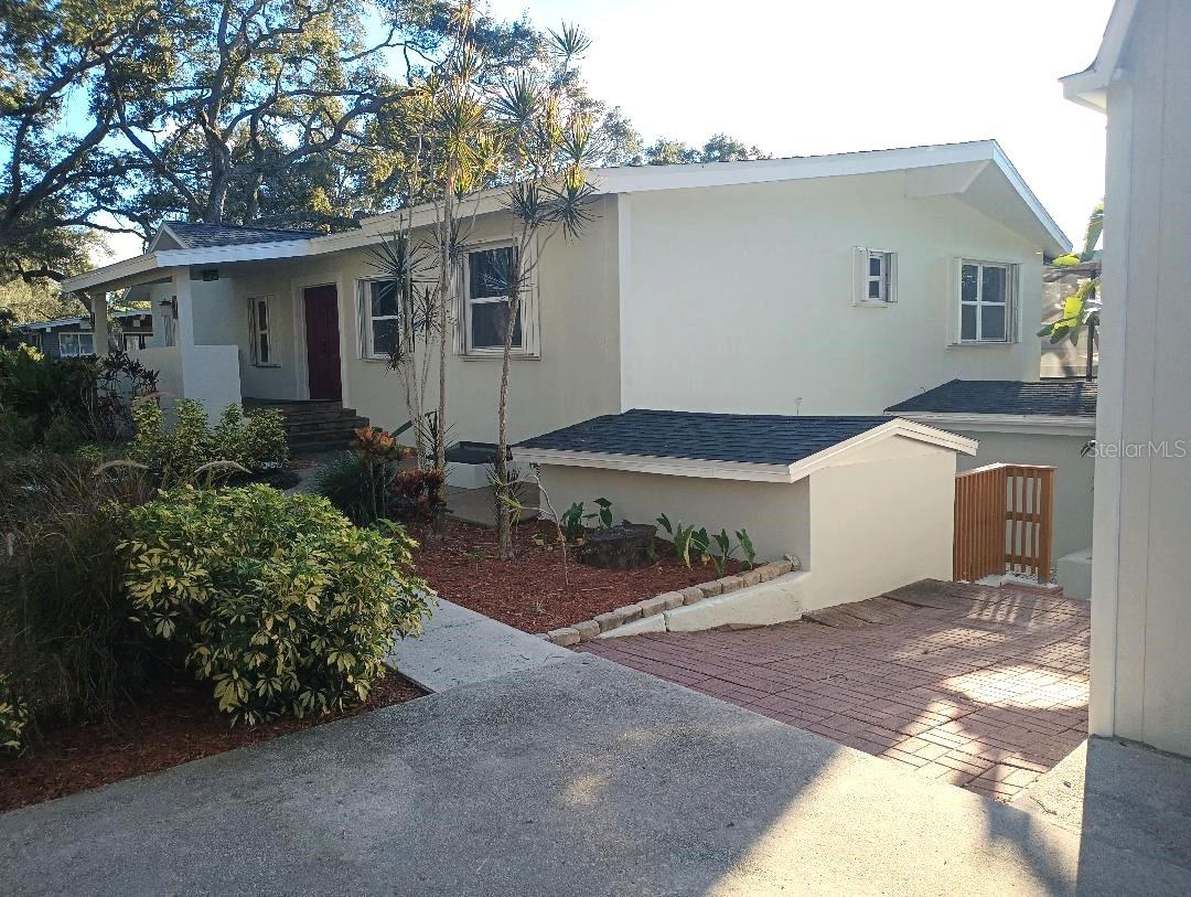 PRICE REDUCED. This tastefully remodeled, ready to move in Home, is in an exceptional Location, just next to Phillippe Park's Main Entrance, in Safety Harbor.  Featuring a 3,802 sqft. Main House, with 4 Bedrooms + 1 office room and 4 full Bathrooms, and adjanced  Guesthouse of 1,120sqft. with a 480 sqft,1 bed/1 bath remodeled Apartment, and a 640 Sq Ft. Garage. Resulting to a total of 5,843 sqft. for this Property.
Also featuring a large heated pool, with a newly paved French pattern Stone Deck, and a covered oversized Porch, with full-sized outdoor Kitchen, is able to entertain large parties, and create unforgettable Memories, with Family and Friends.
The layout on the first floor Main Entrance Level, features a large Foyer, with a 5x5 sqft Coat Room, a large Great Room, and a split Floorplan with 5 Bedrooms and 3 full Bathrooms.
From the first level there is a staircase leading to the downstairs living area, with Kitchen and a Island workstation, and a Family/Dining Room area, next to a Bonus/Game Room, there is also a Full Bathroom, a wine Cellar Storage Room and a 9 x 13 sq ft. Laundry Room, and direct access to the Pool and Outdoor Entertainment area.
Also featuring NEW Roofs on both Buildings, double glass windows and hurricane shutters. French doors, all new fixtures, LED bulbs and electronic mirrors. Many closet spaces, Smart A/C thermostat and smart water heater control with Wi-Fi, and an Osmosis system for the entire Property.
New carpet, new Tiles, and new Travertine Floor. French Drainage outside, and a Pump stabilizer inside. 
There is much more to list on this Amazing Property, located on this Serene and Charming Street, near Downtown Safety Harbor and all Amenities. SELLER VERY MOTIVATED.