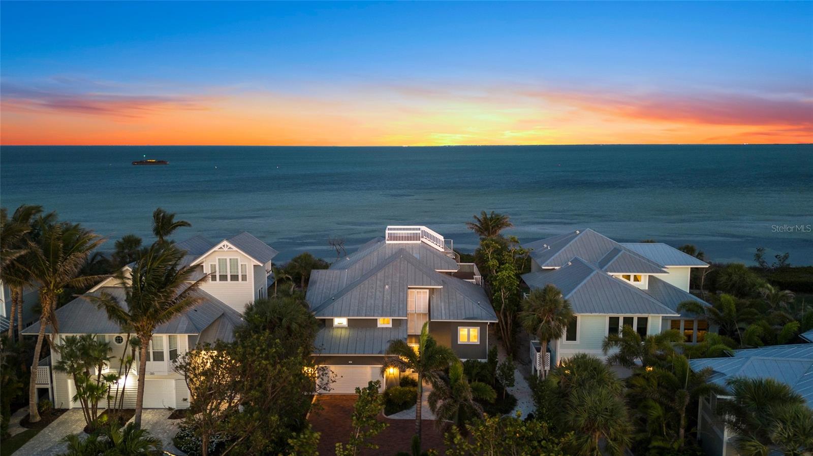 THIS IS YOUR OPPORTUNITY – Remodeled and walk-in ready! Come explore the exceptional panoramic sparkling water views from this well-maintained residence nestled on the shores of Charlotte Harbor in the “North Bay” neighborhood of Boca Bay. The home is beautifully updated with new furniture and is being offered Turn-Key for immediate use. Featuring stunning wood floors and coastal contemporary updates to the bathrooms and kitchen – including new cabinets, lighting, and more. Offering four bedrooms (including a bunk room) and four full bathrooms, all clean and inviting, with excellent bonus space throughout.

The metal roof, clapboard siding, and spectacular rooftop deck (that never misses a sunset) all contribute to that timeless Old Florida charm. All impact glass windows and sliding glass doors are already in place for added peace of mind. Mother Nature at her best with exceptional views from every level! For the fisherman, paddle boarder, or kayaker, you can walk out and wade the nearby grass flats and sand bars, which offer some of the best fishing in and around Boca Grande.

As part of the Boca Bay community, this property enjoys access to community pools, the exclusive Pass Club, and available boat dockage – offering a complete coastal lifestyle. This residence represents a terrific value for an open bay view / bayfront home. Come and explore this enchanting opportunity.