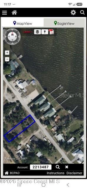 Build your Coastal Dream Across from the Indian River! Discover the perfect setting for your future home on this beautiful vacant lot ideally located just across the street from the scenic Indian River. This generously sized parcel offers a peaceful, natural setting with mature trees that provide privacy, shade, and endless possibilities for your custom home. Enjoy the beauty of Florida's Space Coast with nearby views of the river, spectacular sunrises, and rocket launches from Kennedy Space Center. Conveniently located near public boat ramps, fishing, waterfront parks, beaches, shopping, and dining, this property combines a tranquil atmosphere with easy access to everyday amenities. Whether you're planning your forever home, a seasonal retreat, or an investment property, this prime location offers the best of coastal living. Don't miss this opportunity to own a slice of paradise in on of the area's most desirable waterfront communities! Lots to the west of property may be available.