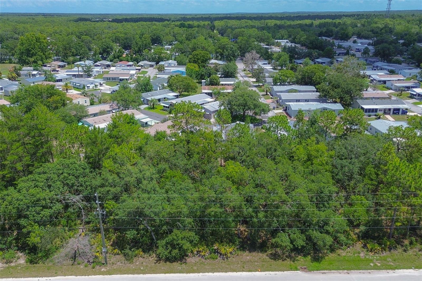 Imagine a peaceful slice of Florida just waiting to bring your vision to life—welcome to 6859 W Merrivale Lane, a gem tucked within the Oakdale Estates. This blank canvas of 0.21 acres, framed by the dimensions of 75 by 120 feet, offers the ideal foundation for your dream home. Whether you're envisioning a cozy retreat or a modern sanctuary surrounded by nature, this property gives you the freedom to build to your heart's content. Situated on a paved road with 75 feet of frontage, access is smooth and straightforward, making every return home feel like a breeze. The lot lies in a flood zone X, offering peace of mind and fewer insurance concerns. This is land that whispers potential—elevated, dry, and ready for construction with essential utilities like electricity and public water already available at the site. A well will be required to complete your water system, and septic installation will be necessary to finish out the infrastructure—standard and manageable steps toward creating your personalized space. With no HOA to dictate your design choices, you're free to construct your haven exactly as you envision it. Whether that means adding a workshop, extra storage, or even space for your pets to roam (yes, pets are welcome!), the possibilities are only limited by your imagination. There's no association telling you how often you can rent it out or whether your architectural style fits a mold—this is freedom to build, live, and invest your way. Beyond the bounds of this lot, you're surrounded by the quiet charm of a growing community. Adjacent state-owned land adds to the privacy and natural beauty, making this not just a place to live, but a place to thrive in connection with the land. The setting is serene, the road is paved, and the sunrises are yours to savor. Whether you're looking to break ground now or invest for the future, 6859 W Merrivale Lane is more than just a lot—it's a launchpad for possibility. Secure your spot in the sunshine and start imagining the life you could build here. The ground is ready. Are you?