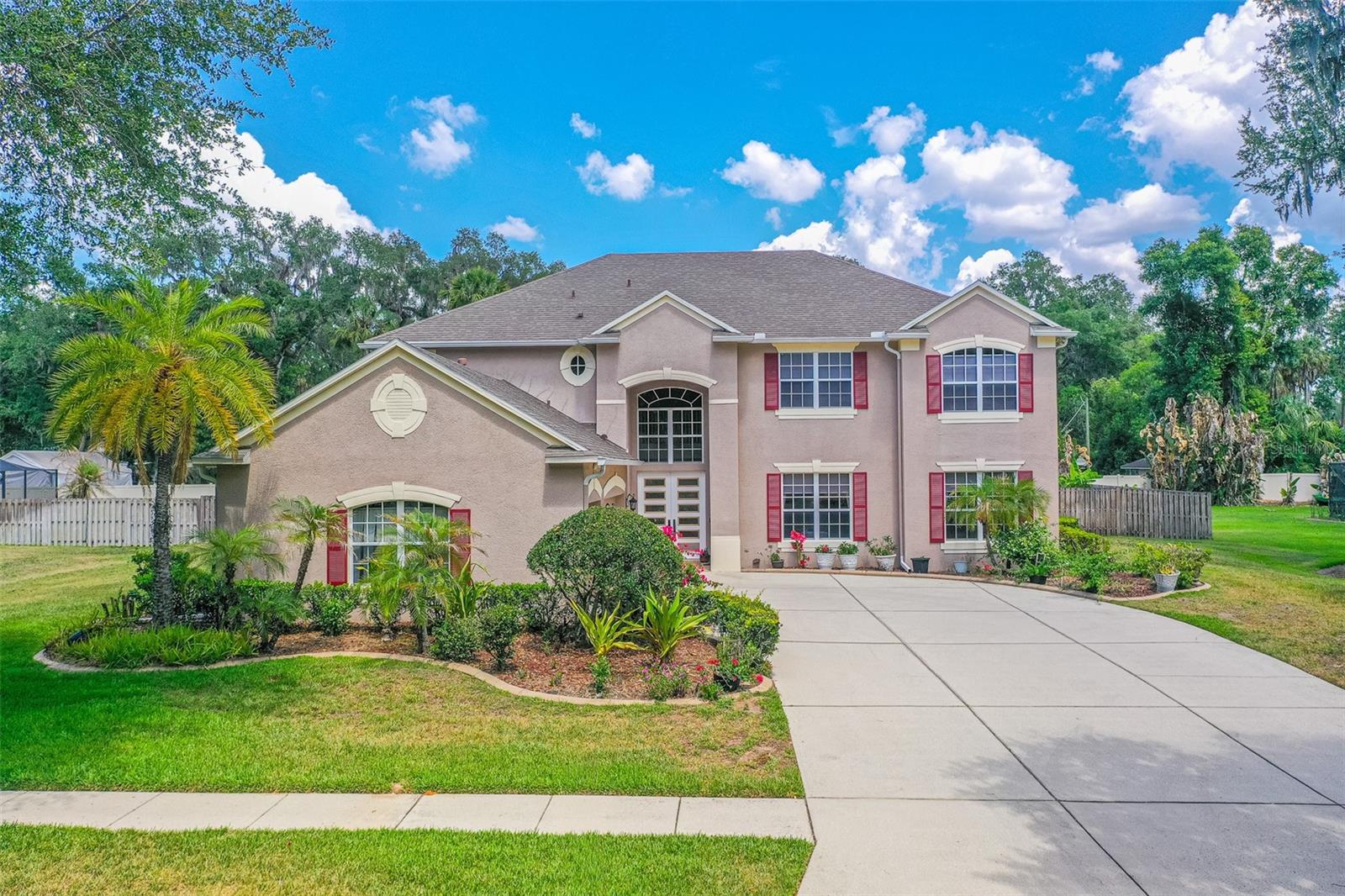 Welcome to this spacious and beautifully maintained two-story home in desirable Seffner, offering 6 bedrooms, 4 bathrooms, and an impressive layout designed for comfortable living and entertaining. Built with durable stucco block construction and topped with a 3-year-old shingle roof, this exceptional residence combines generous living space, quality upgrades, and timeless appeal.

From the moment you arrive, you'll be captivated by the mature landscaping, oversized 3-car garage, elegant French front doors, whole-home STANDBY GENERATOR, THREE BRAND NEW A/C units, OWNED WATER SOFTENER SYSTEM, and numerous major mechanical updates that provide exceptional value and peace of mind. Additional improvements include a 5-year-old water heater and a gas-powered heating system, ensuring year-round comfort and efficiency.

Inside, soaring dramatic 36-FOOT CEILINGS and expansive open-concept living areas filled with natural light create the perfect blend of comfort and sophistication. The home features beautiful wood flooring throughout the main living areas, ceramic tile in the kitchen, and comfortable carpeted bedrooms designed for warmth and relaxation.

Designed with versatility in mind, this home offers two separate living rooms plus a LARGE GAME ROOM, providing endless possibilities for entertaining, relaxing, working from home, creating a media room, or designing the ultimate recreation space. The oversized kitchen serves as the heart of the home, showcasing a massive center island, elegant granite countertops, extensive cabinetry, and abundant storage space ideal for both everyday living and hosting gatherings.

Conveniently connected to the spacious screened and enclosed patio, the kitchen provides seamless indoor-outdoor flow, making entertaining and family gatherings effortless while enjoying Florida living year-round.

The generously sized primary suite serves as a private retreat featuring a large walk-in closet and a luxurious ensuite bathroom complete with dual sinks, a relaxing garden tub, separate shower, and private water closet.

Conveniently located near Interstate 4 and Interstate 75, this home offers easy access to Tampa, Brandon, shopping, dining, entertainment, parks, medical facilities, and Brandon Town Center. Combining abundant living space, major system upgrades, energy-efficient features, and a prime location, this move-in-ready property delivers everything today's buyers have been searching for.