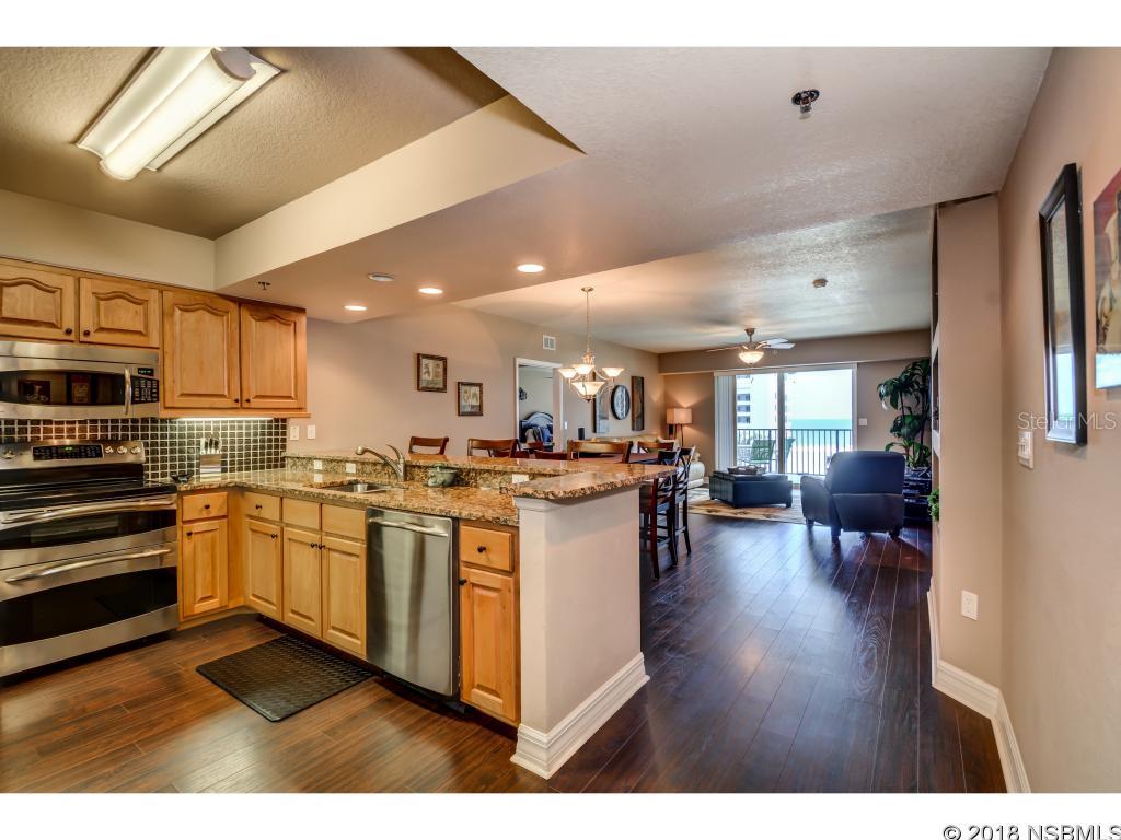 Luxurious Junior Penthouse with fantastic views of the ocean. Located across from the beach access and next to the newest clubhouse with pool and hot tub. Many upgrades, wood floors, granite kitchen, built inâs, stainless steel appliances and much more. This unit is beautifully decorated and is in immaculate condition. Shows like a model home, so bring your most discriminating buyer. Ocean Walk offers many amenities such as, Kayak launch, shuffle board, bocce court, fire pit, small movie theater, 2 lighted tennis court, BBQ, fitness centers, pools and hot tub. ;LocationDescription: Condo ;Water: City