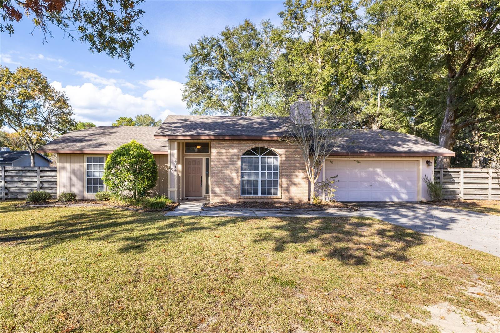 Welcome to Buckridge! This 3Br/2Ba 1,259 square foot home has a fully fenced in back yard and is located on a corner lot. New roof in 2015, new A/C in 2017, new gas water heater in 2019, new refrigerator and gas oven in 2017, and new microwave in 2020. There are wood cabinets and upgraded quartz countertops in the kitchen, the bathrooms have been updated, the family room has a nice brick fireplace.  There is wood laminate flooring in the living area and upgraded tile in the bedrooms. This home in conveniently located to A rated schools and shopping.