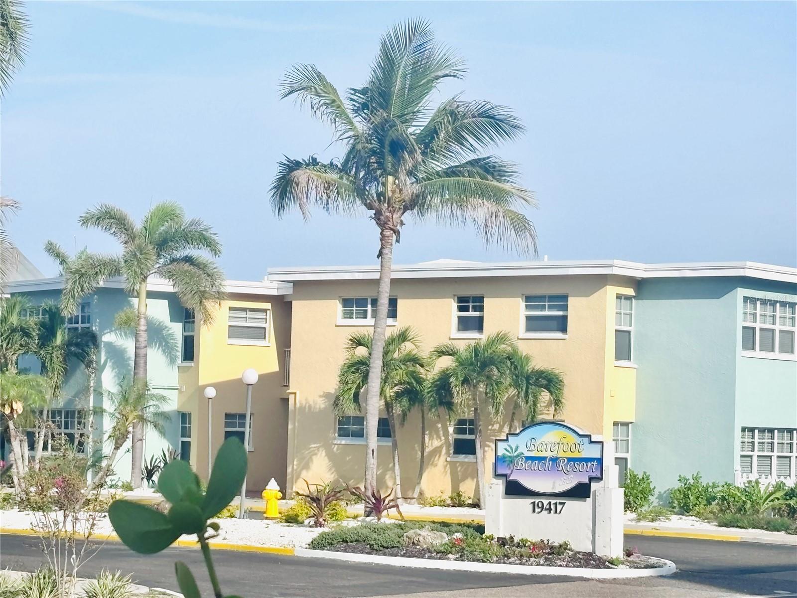 Experience resort-style living on five acres of waterfront property at Barefoot Beach Resort.  This unique setting offers a peaceful, tropical oasis with native landscaping, a relaxed
coastal ambiance, and easy access to some of Florida’s most beautiful beaches.
Unit B-209 is a desirable corner unit located on the 2nd floor, perfectly positioned to provide added privacy while still offering tranquil views from your front door—without the premium waterfront price. Located on the second floor for added peace
of mind, this fully furnished 2-bedroom, 1-bath condo comfortably sleeps 6 with a sleeper sofa.
This condo features a spacious and functional layout with a full-size kitchen, living and dining areas, a primary bedroom, and a
bonus sun room—perfect for relaxing after a day at the beach.  Step outside and enjoy everything this waterfront community has to offer. The heated pool and patio area—just a short walk from your door—feature ample lounge seating for soaking up the
sun. Multiple grilling stations provide the perfect setting for outdoor dining, while the fishing
dock, equipped with electricity and water, allows you to catch and prepare your own fresh
seafood. Boat slips are also available for separate purchase, making this an ideal spot for boating
enthusiasts. Whether you’re seeking a full-time residence, vacation getaway, or income-producing property,
this condo offers exceptional flexibility. It is sold fully furnished and turnkey, with a strong rental
history and onsite rental management available—allowing you to generate income without the
hassle of day-to-day oversight.
Barefoot Beach Resort is located in the charming coastal beach town, known for
its laid-back atmosphere and small-town feel, yet conveniently close to Clearwater Beach, St.
Pete Beach, and Tampa. From boating and fishing to beach days and sunset strolls, this location
offers the perfect blend of relaxation and recreation.