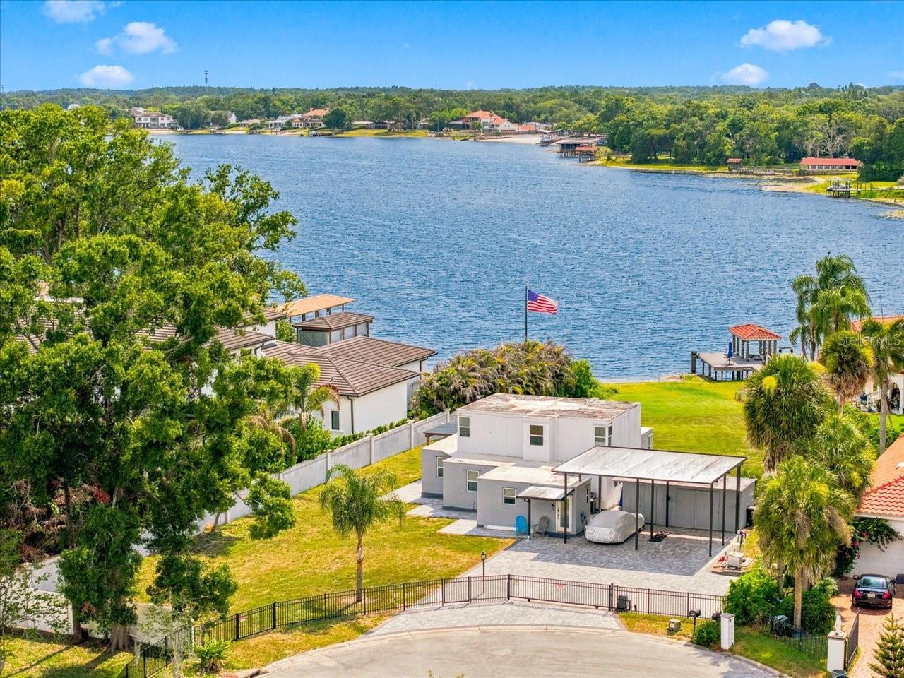 An exceptional opportunity to own on the coveted shores of Lake Carroll, one of Tampa's premier private ski lakes. Whether you're searching for a waterfront home to enjoy today or envisioning creating your dream estate, this property offers endless possibilities in an unbeatable location. Situated on one of the area's most desirable lakes, Lake Carroll is known for its skiing, wakeboarding, fishing, paddleboarding, kayaking, and breathtaking sunset views. With approximately 210 acres of private lake access, residents enjoy an unmatched waterfront lifestyle just minutes from shopping, dining, major highways, and Tampa International Airport. The existing residence has been tastefully remodeled and features three bedrooms, a dedicated office or flex space, and two updated bathrooms, offering comfortable living while you enjoy everything this incredible property has to offer.  Opportunities to secure waterfront property on Lake Carroll are increasingly rare. Whether your plans are immediate or for the future, this is your chance to invest in one of Tampa's most sought-after lakefront communities.