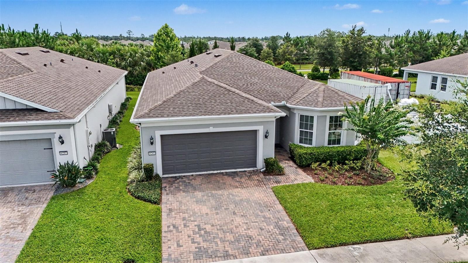 Welcome to 6261 Citrus Grove Court, a beautifully maintained and thoughtfully upgraded home in the highly sought-after DEL WEBB SUNBRIDGE community in St. Cloud. Why wait months for NEW CONSTRUCTION when you can move right into a home that already has the upgrades, finishing touches, and attention to detail today's buyers are looking for?

From the moment you arrive, you'll appreciate the care and pride of ownership that make this MOVE-IN READY home truly stand out. Inside, TILE FLOORING flows throughout the main living areas, creating a seamless and elegant look that's both stylish and easy to maintain.

The heart of the home is the UPGRADED GOURMET KITCHEN, designed for both everyday living and entertaining. Thoughtful touches like additional storage cabinetry at the end of the island and an electrical outlet conveniently located in the center of the living room add functionality you'll appreciate every day.

A versatile FLEX ROOM with UPGRADED FRENCH DOORS offers endless possibilities as a HOME OFFICE, TV ROOM, hobby space, fitness room, or potential THIRD BEDROOM. The spacious secondary bedroom features an EXTENDED BAY WINDOW area, creating a bright and inviting retreat with additional usable space.

The PRIMARY SUITE serves as a relaxing getaway, highlighted by an UPGRADED EXTENDED WALK-IN SHOWER featuring a built-in bench and FLOOR-TO-CEILING TILE for a spa-inspired experience. Every detail has been carefully selected to combine comfort, style, and convenience.

Storage is abundant throughout the home, including an OVERSIZED INTERIOR STORAGE ROOM located just off the laundry area. The UPGRADED LAUNDRY ROOM features additional CABINETRY and an UPGRADED UTILITY SINK, making household tasks more efficient while providing even more storage space. The TANDEM GARAGE offers flexibility for a golf cart, workshop area, recreational equipment, or extra storage.

Step outside and enjoy Florida living year-round from the UPGRADED COVERED AND SCREENED LANAI, the perfect place to relax with your morning coffee, entertain guests, or unwind at the end of the day.

Located within DEL WEBB SUNBRIDGE, residents enjoy a vibrant lifestyle, outstanding amenities, and PROFESSIONALLY MAINTAINED LANDSCAPING that allows for more time enjoying the community and less time worrying about exterior maintenance.

If you've been searching for a WELL-MAINTAINED, MOVE-IN READY home with exceptional upgrades, flexible living spaces, abundant storage, and the convenience of DEL WEBB SUNBRIDGE living, 6261 Citrus Grove Court deserves a place at the top of your list.