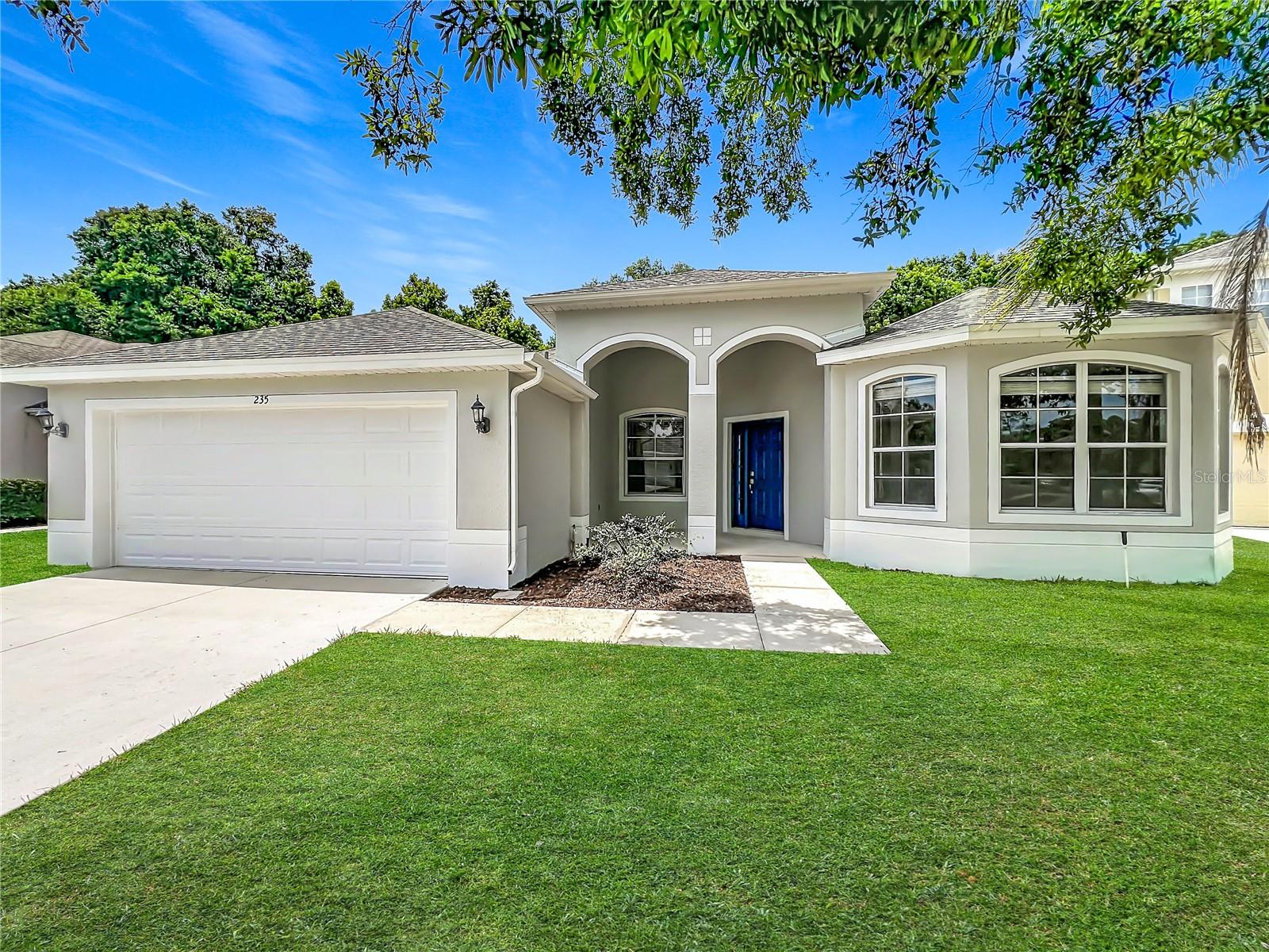 Welcome to Magnolia Park, one of Sanford’s desirable gated communities, where this single-story home offers the perfect blend of space, comfort, and convenience. Situated on nearly a quarter-acre lot with no rear neighbors, this 4-bedroom, 3-bathroom home features over 2,300 square feet of thoughtfully designed living space and a freshly painted exterior completed just before hitting the market. Step inside to an open floor plan with soaring ceilings and a split-bedroom layout designed for everyday living. The welcoming foyer is flanked by a formal dining room and a versatile flex space that makes an ideal home office, playroom, or sitting room. At the heart of the home, the spacious family room flows seamlessly into the kitchen and breakfast nook, creating the perfect gathering space. The kitchen features wood cabinetry, Corian countertops, stainless steel appliances, and plenty of prep and storage space. Sliding glass doors lead to the covered lanai and spacious backyard, where you'll enjoy peaceful views with no homes directly behind you. The oversized yard offers endless possibilities, whether you envision a future pool, outdoor entertaining area, garden, or plenty of room for pets and play. The private primary suite serves as a retreat with a large walk-in closet, additional built-in closet, dual vanities, soaking tub, and separate shower. Two secondary bedrooms share a guest bathroom on one side of the home, while the fourth bedroom is tucked away at the rear of the property with direct patio access, making it an ideal guest suite, in-law space, or private retreat for multigenerational living. Additional highlights include tile and luxury vinyl plank flooring throughout, an interior laundry room, and a spacious two-car garage. Major updates provide peace of mind, including a roof replacement in 2021 and HVAC system in 2020. A new concrete driveway was installed in 2024. Exterior painting of home was completed in June 2026. Conveniently located just minutes from Sanford's vibrant historic downtown, you'll enjoy easy access to local restaurants, breweries, shops, parks, and waterfront attractions. Commuters will appreciate quick access to the 417 Expressway, connecting you to all that Central Florida has to offer. Don't miss your opportunity to own this spacious and move-in-ready home in Magnolia Park.