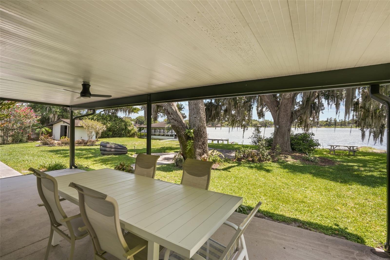 Priced for a QUICK SALE! Welcome to this one-of-a-kind lakefront home nestled on 1.14 acres along the shores of Lake Jessamine — one of Orlando's most sought-after ski lakes! With stunning water views from throughout the home and direct lake access perfect for boating, skiing, fishing, and year-round waterfront recreation, this is the Florida lifestyle you've been dreaming of.
This warm and inviting 3-bedroom, 3-bath home, plus an office and an optional 4th bedroom, spans 2,580 sq ft. The open and airy feel makes every day feel like a retreat, whether you're enjoying a quiet morning watching the sunrise over the water or entertaining friends and family in this spectacular setting.  Known updates include: NEW Metal Roof (2021), PAID-FOR Solar Panels (2022), New pump for lake-water irrigation.
Outside, enjoy fishing from the dock or relax in the 495 sq ft grandfathered-in screened boathouse with electricity and boat lift— a truly rare feature that adds exceptional value and creates the perfect setting for lakeside entertaining. There is also a block shed with power, which would make an amazing cabana.  Located on a cul-de-sac with NO HOA, privacy and tranquility are truly yours to enjoy.  Conveniently located in Orlando with easy access to major roadways, shopping, dining, and top-rated amenities — all while feeling like your own private paradise. Lakefront properties like this don't come along often. Contact me today to schedule your private showing before this gem is gone!
