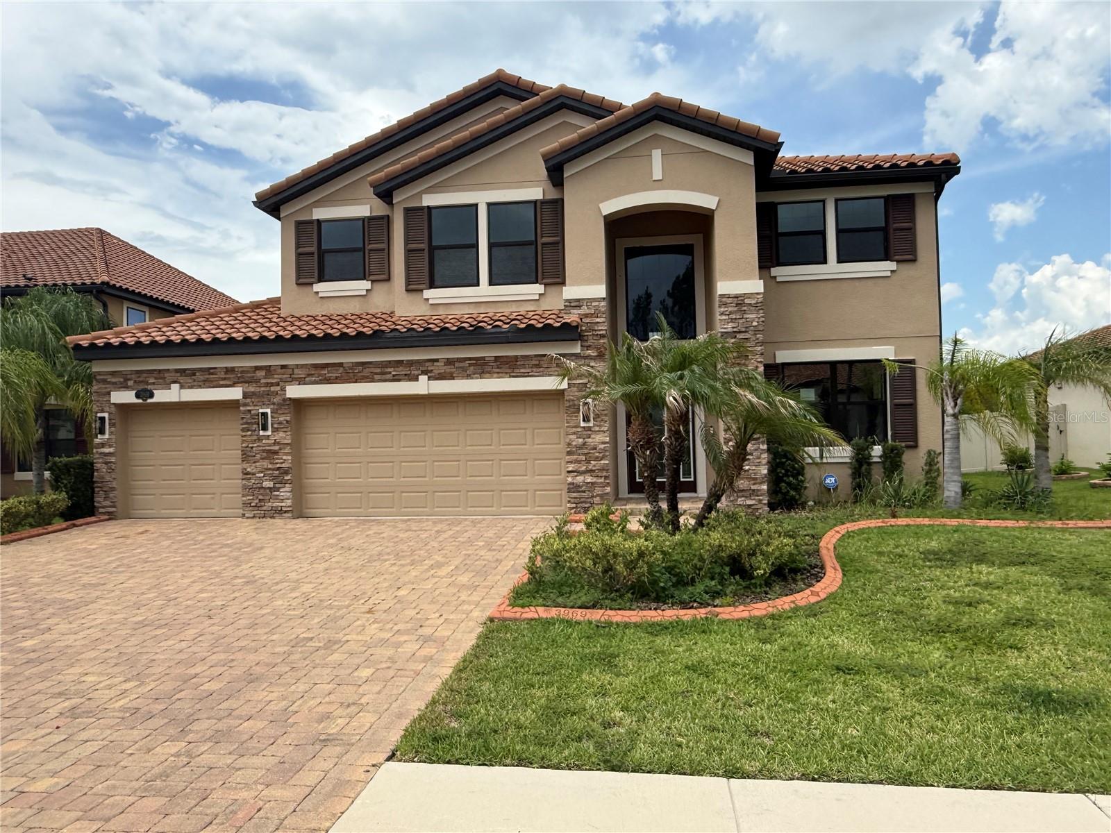5-bedroom home is ready and waiting in sought-after gated community of TerraLargo! With over 3500 Square feet, this lovely 2 story home has a lot to offer. FRESHLY PAINTED inside, NEW Luxury Vinyl Flooring upstairs, NEW lighting fixtures, NEW APPLIANCE(s), NEW interior doors too . A formal dining room greets you at the entrance. Just beyond is the beautiful kitchen with butlers' hall pantry and a huge center island, handsome wood cabinetry, granite counters- eat in breakfast area is perfect for coffee or homework spot. The family room is very spacious and is completely tiled. It has access to the screened lanai through slider and is flanked by a wrought iron staircase. There is a downstairs bedroom as well as a full bathroom. Upstairs opens to an oversized loft - added space for lounging, gaming or entertaining.  This area splits off to the primary suite - large walk-in closet, double vanity, step in shower and soaking tub. 3 more secondary bedrooms round out the upstairs with 2 full bathrooms. Oversized 3 car garage has an enclosed area that is perfect for projects...So much flexibility in this floor plan and only a short drive to downtown Tampa, close to eateries, hospital, shopping...It's good to be home!