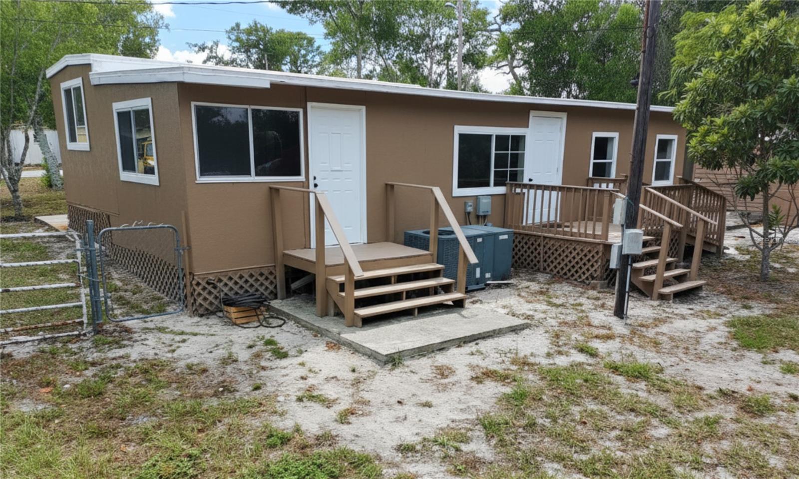 One or more photo(s) has been virtually staged. MOTIVATED SELLERS! Rare lakefront opportunity in Highland Lakes, Weeki Wachee: completely renovated 3BR/1BA manufactured home on an expansive 0.40-acre lot (approx. 15,250 SF). Enjoy a serene lakefront setting at the rear of the property, plus a fully fenced, tree-shaded yard with a gazebo equipped with water and electricity, a 30-amp RV outlet, and additional storage structures. The home features a front Florida room/enclosed porch, vinyl plank flooring in the bedrooms, tile flooring in the remaining areas, soft-close cabinetry, granite countertops, and a remodeled bathroom with updated fixtures and shower. New roof installed in February 2025. Well and septic. Convenient location with easy access to US-19 and Cortez Blvd, shopping, dining, and Weeki Wachee Springs State Park. Schedule showing today!