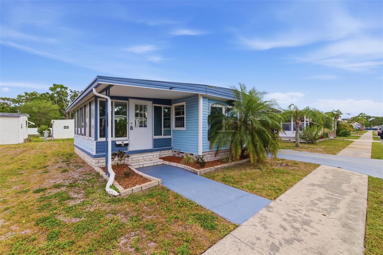 Don’t miss this incredible chance to own your own piece of paradise! This fully furnished 2-bedroom, 1-bath home is move-in ready—just bring your clothes and toothbrush. Featuring a bright, open floor plan, the property has been meticulously cared for and thoughtfully updated.

Relax in the inviting screened porch, complete with comfortable seating, a TV, market lighting, and a spacious storage room. There’s also an additional open patio area, perfect for enjoying the outdoors. Recent upgrades include a new roof-over (2021), updated subflooring in the living room and hallway, and new laminate flooring throughout. The Florida room is equipped with its own brand-new AC/heat unit, and the main HVAC system has been updated in 2025. Solar panels installed over the carport help keep electric costs low.

Situated in a resident-owned community with generously sized lots, you’ll enjoy extra space and privacy. Amenities include a heated pool, social activities, and well-maintained outdoor areas. Rentals are not permitted.

Conveniently located near shopping, dining, and beautiful local beaches—come experience the best of the Florida lifestyle!