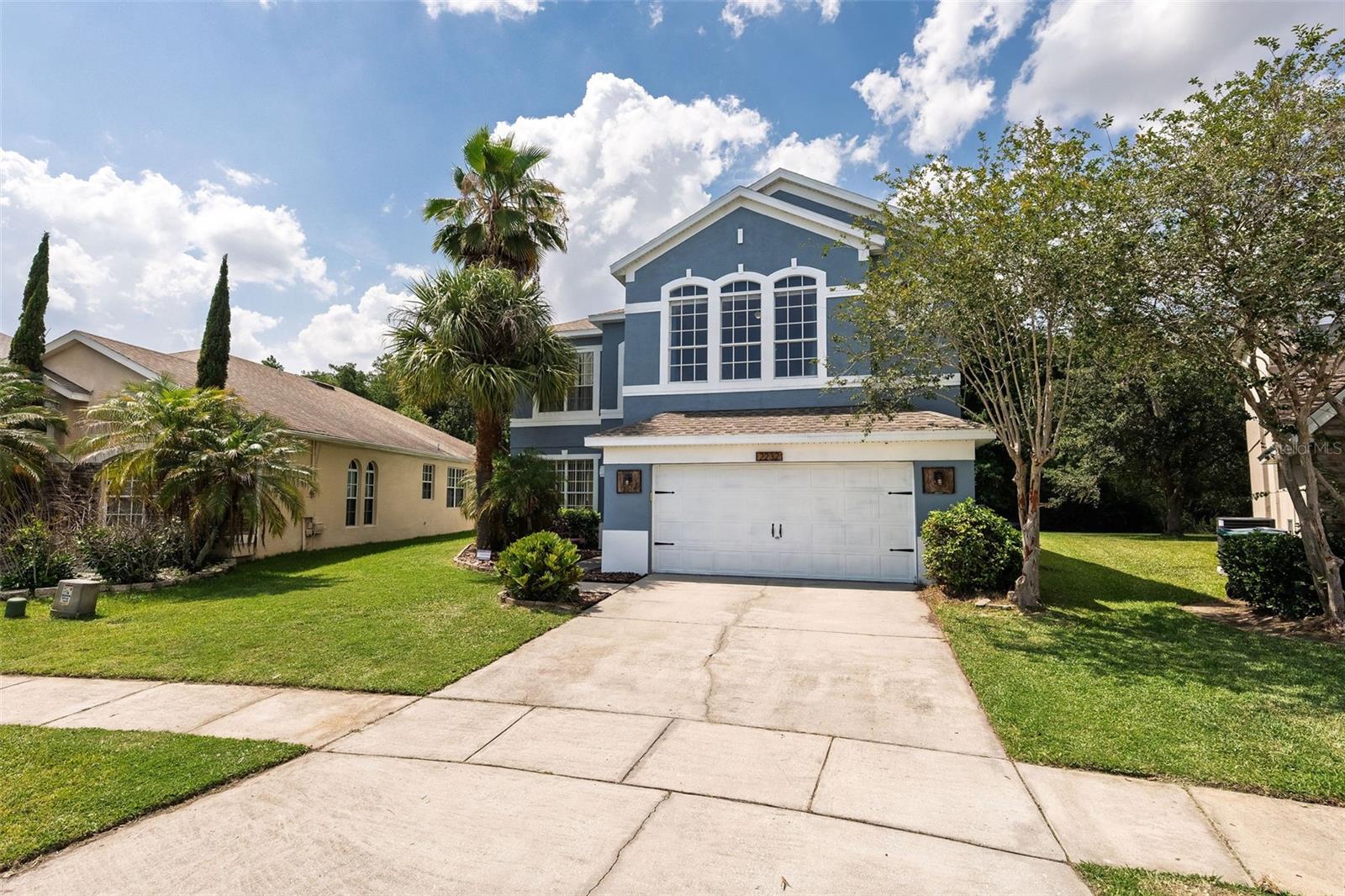 Welcome to WINDCREST—a highly sought-after gated community of Wyndham Lakes! This lovely 2-story residence covers over 3,000 sq ft, providing comfort and elegance. A large, open eat–in kitchen (fully stocked with appliances) offers great views of the backyard. Enjoy the serenity of a screened-in paver patio and private pool, abutting a wooded area (so no rear neighbors!) and a nearby, tranquil pond.
The ground floor has a formal living room and dining room, providing plenty of room to entertain. The second floor has four bedrooms, including a spacious primary suite featuring a walk-in closet, dual sinks, and a relaxing garden tub. The loft area is a versatile bonus room—ideal for an office, gym, or playroom. Additional features include a NEWER ROOF (2024), a hot water heater installed in 2024, and HVAC system installed in December of 2020. Don't miss a great opportunity to make this property your new home!