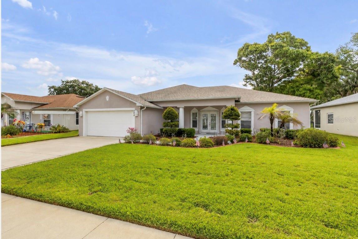 The moment you step through the front door at 349 Mariners Gate Drive, your eyes are immediately drawn beyond the main living space to the peaceful pond views waiting in the backyard. It creates an instant feeling of calm — open, inviting, and thoughtfully designed for both everyday comfort and peace of mind during Florida’s storm season.  Inside, this 4-bedroom plus den, 2-bath single-family home offers 2,240 square feet of well-designed living space featuring Luxury Vinyl Plank flooring throughout. The flexible floor plan easily adapts to today’s lifestyle needs, whether you’re working from home, hosting guests, creating a hobby space, or simply looking for room to spread out. Natural light flows through the main living areas, creating a bright and connected feel throughout the home.  The kitchen is finished with granite countertops and overlooks the living and dining spaces, making it equally functional for daily living and entertaining. Just beyond, the screened rear porch provides the perfect transition from indoor comfort to outdoor relaxation, all while taking in the tranquil water views.
Important system updates have already been completed, including a 2019 roof replacement and a 2020 HVAC system equipped with UV light air purification. The exterior has also been coated with elastomeric paint, a premium weather-resistant finish designed to help protect and preserve the home for years to come.  What truly separates this property is its impressive level of hurricane preparedness. An owned 250-gallon propane tank services the range, dryer, water heater, and whole-house generator — delivering an added level of functionality, convenience, and confidence that Florida homeowners increasingly value.  Situated on a spacious 75 x 115 lot, this home combines water views, screened outdoor living, modern updates, and storm-ready features into one well-rounded package of comfort, beauty, and practicality.
Schedule your private showing today and experience firsthand everything this thoughtfully prepared home has to offer.