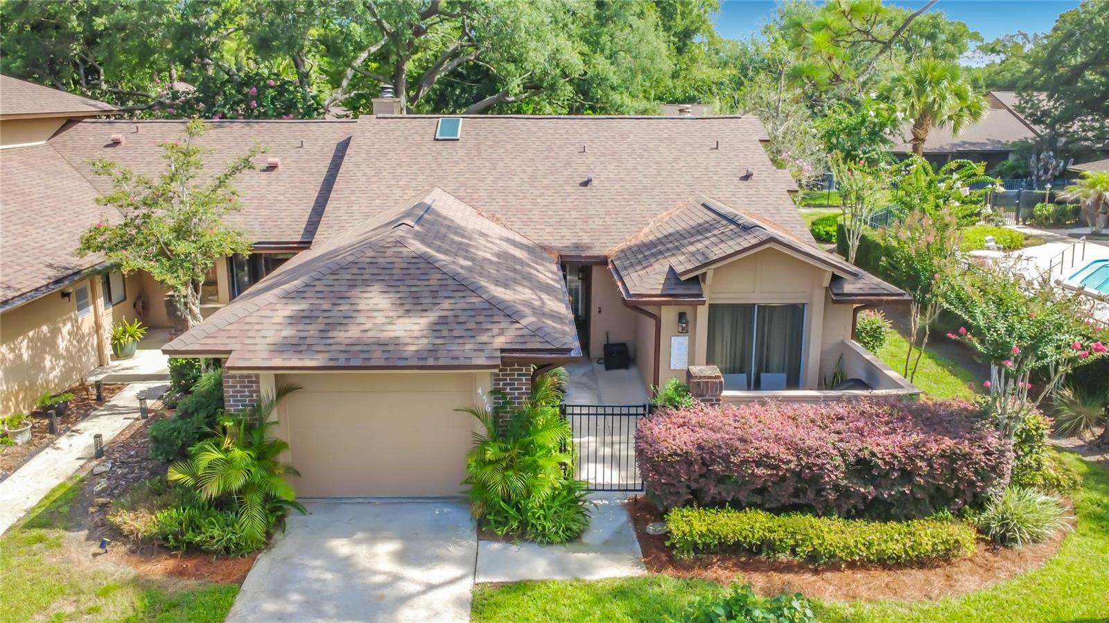 Welcome to 456 Newton Place, a beautifully maintained single-story townhome nestled in the highly desirable Governor's Point community within Wekiva Hunt Club in Seminole County. Rarely available, this 3-bedroom, 2-bath corner unit offers the perfect blend of comfort, privacy, and low-maintenance living in one of Central Florida's most sought-after neighborhoods. Ideally situated just steps from the community pool, this home features multiple outdoor living spaces, including a charming gated front courtyard and a private rear patio overlooking peaceful green space—perfect for enjoying your morning coffee or relaxing at the end of the day in this quiet location. Inside, you'll find an inviting open floor plan highlighted by soaring vaulted ceilings, abundant natural light, and a cozy wood-burning fireplace that creates a warm and welcoming living space. The spacious primary suite also features vaulted ceilings, an ensuite bath, and a tranquil atmosphere. An enclosed, air-conditioned Florida room provides additional flexible living space, ideal for a home office, reading room, or year-round sunroom. Enjoy the ease of maintenance-free living with an HOA that covers exterior maintenance, landscaping, irrigation, pest control, and more. Residents also enjoy full access to the exceptional amenities of the Wekiva Hunt Club Association, including the community pool, tennis courts, playgrounds, parks, and miles of scenic walking and biking trails. Guest parking is conveniently located nearby for family and visitors. Perfectly positioned near Wekiva Springs State Park, Wekiva Island, Wekiva Golf Club, top-rated Seminole County schools, shopping, dining, and major roadways, this home offers the ideal combination of natural beauty, recreation, convenience, and carefree Florida living. Don't miss this rare opportunity to own one of Governor's Point's most desirable corner-unit townhomes. Schedule your private showing today!