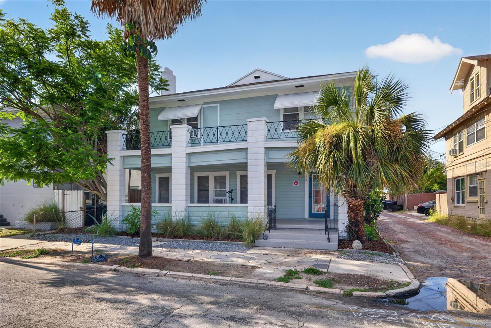 Excellent cash flowing and investment opportunity right on the main drag in St. Pete’s highly desirable Uptown neighborhood, known for its charming brick-lined streets and close proximity to downtown grossing $110,460 / year. This unique offering features six total units across two buildings: a quadplex building and a separate detached building with two units on top of 4 garage bays. The quadplex building is located at the front of the property and has a large 1 bed/1 bath on the first floor with a private yard, a 1 bed/1 bath unit and a 2 bed/1 bath dorm style unit on the second floor. The building also has a 1 bed/1 bath apartment on the first floor with separate access from the side of the building. Behind the quadplex sits the two traditional studio apartments on top of 4 large garage bays. The garage bays can be rented out for additional income or kept for storage space for the owner or tenants. Additional property highlights include large front porches on both structures, parking for 2 cars in front of the garage bays, and ample on-street parking. Whether you choose to live in one unit and rent the rest or lease all six for maximum returns, this property is primed for strong passive income. The building received some updates in 2026, and professional property management is already in place and willing to continue. Located less than 2 blocks from Downtown St. Pete and under 30 minutes to both Downtown Tampa and the Gulf Beaches, this property offers tenants the perfect balance of lifestyle and convenience, ensuring consistent demand and easy leasing.