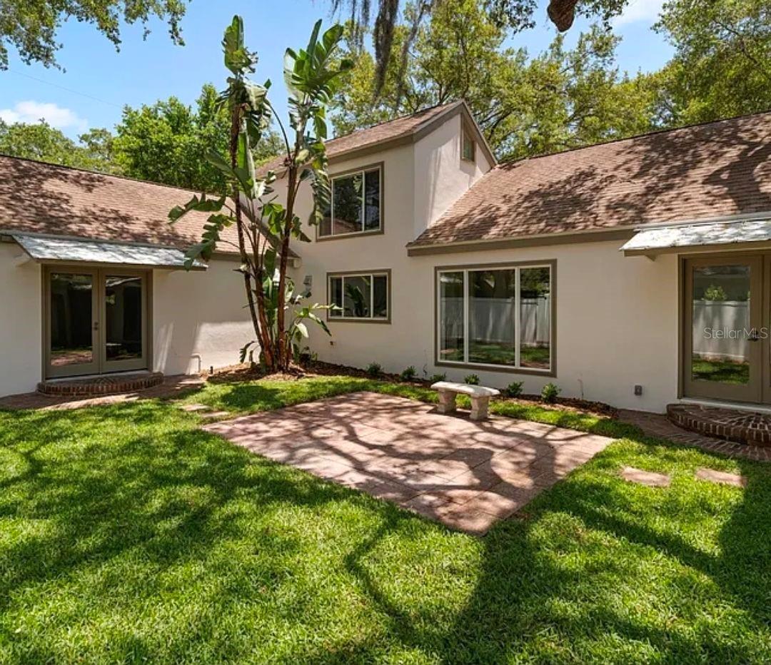 Contemporary and comfortable California-style home. This is a rare find in the rental market. The uniquely laid out floor plan has 3 bedrooms, 2.5 baths, and was just completely renovated top to bottom with designer taste. Built by an architect for his own family, it has wonderful design features including high ceilings, natural light and French doors that open up to a large courtyard. New landscaping but kept the mature oak trees. Greenery visible from almost everywhere in the house. Living room with wood burning fireplace, and wood-look porcelain tile flooring throughout. Easy to maintain and looks great. New high quality wood cabinetry, quartz countertops, new GE appliances including an oversize refrigerator. Dining room, breakfast nook, pantry, linen and coat closets. Master suite and 2nd bedroom are on the first floor. En-suite master bath has a double vanity and a large two-person shower. Walk-in master closet. Washer/dryer provided if desired. Modern spiral stairs take you to the large loft 3rd bedroom / home office on the second floor which offers a half bath, closet and view of the grassy courtyard and large trees. The courtyard and backyard are fully fenced with new fencing. Timed irrigation using reclaimed water as well as landscape maintenance service is included in the rent. There's also a wooden shed with shelves adjacent to the 2-car carport for storage. Must see this house!