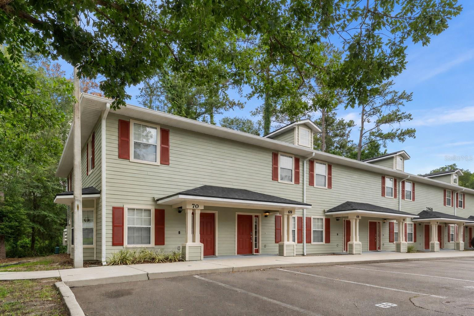 Very clean 3BR/3BA - On the Bus Line and just 1.5 miles from the University of Florida! Unit is located at rear of the community and backs up to peaceful greenspace. The pool is steps from the front door. Ideal as a primary residence, second home, or rental. Step inside to an open floor plan featuring your living room and sleek kitchen with real wood cabinets and granite countertops. Convenient reserved parking space right out front and guest parking close by. Prime location near Shands Hospital, the UF Vet School, I-75, and the shops and dining at Butler Plaza—everything you need is just minutes away. HOA covers the pool, roof, exterior maintenance, landscaping, fiber optic internet, and trash service—making for easy, worry free living. Schedule your private showing today and see why this one stands out!