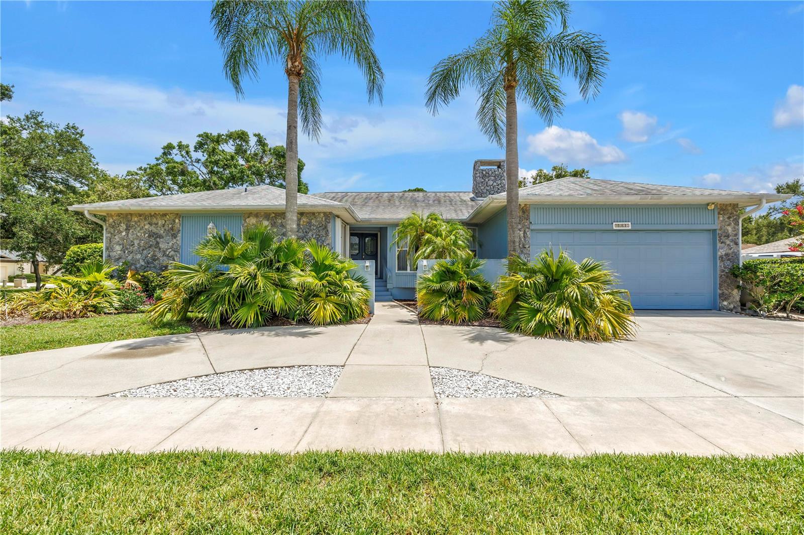 Welcome to 3000 Heron—a beautifully designed pool home in the highly sought-after Feather Sound community of Clearwater—one of Tampa Bay's premier golf course neighborhoods. Ideally located between St. Petersburg and Tampa, Feather Sound is renowned for its beautifully landscaped streets, championship golf course, country club lifestyle, and unparalleled convenience to Tampa International Airport, Clearwater/St. Pete Airport, major business centers, award-winning beaches, and vibrant downtown districts. This spacious home offers a thoughtfully designed split-bedroom floor plan, exceptional storage, and inviting indoor and outdoor living spaces that are perfect for both everyday living and entertaining. A welcoming gated front courtyard leads to the double-door entry and a spacious foyer opening to an elegant formal living and dining areas accented by crown molding, neutral finishes, and abundant natural light. Durable luxury vinyl flooring flows throughout most of the living spaces, complemented by large-format neutral tile in the kitchen and family room for both style and easy maintenance. At the heart of the home is a spacious kitchen designed for gathering, featuring an impressive 11-foot breakfast bar, abundant cabinetry, expansive counter space, pendant lighting, and a built-in desk—perfect for meal planning, working from home, or keeping daily life organized. The adjacent breakfast area and family room create a seamless open-concept living space. The inviting family room is anchored by a wood-burning fireplace with a large hearth and custom floating shelves, creating a warm and comfortable setting for relaxing or entertaining. Double-pane sliding glass doors connect the indoor living areas to the backyard, creating effortless indoor-outdoor flow. Designed with privacy in mind, the split-bedroom floor plan offers a secluded primary suite complete with a spacious bathroom with walk-in shower, spa tub, two vanities and walk-in closet featuring custom organizers. A dedicated home office /4th bedroom with an adjoining powder bath provides the flexibility today's buyers are looking for, whether working remotely or creating a private guest space. The 2nd and 3rd bedrooms are on the opposite side of the home and an adjacent guest bathroom that serves as a pool bath with access to the patio. Storage is one of this home's standout features, with an abundance of closets throughout, a large laundry room, and an additional storage shed offering plenty of space for organization and hobbies. Step outside to your own private Florida retreat. The screen-enclosed pool is surrounded by attractive paver decking and complemented by a covered patio with a relaxing jacuzzi, creating the perfect setting for year-round outdoor living, entertaining, or simply unwinding at the end of the day. Solar panels for the pool extend the swimming season. Additional features include: Roof 2020, HVAC 2016, All new HVAC ductwork and vents 2026, Water heater 2015, Hurricane shutters, Double-pane sliding glass doors, Ceiling fans throughout, and Crown molding. Offering an ideal combination of spacious living, thoughtful updates, abundant storage, and exceptional outdoor amenities, 3000 Heron is a home designed for comfort, functionality to enjoy the Florida lifestyle. This home is elevated and did not experience any flooding during the 2024 storm season. Low flood insurance premiums available.